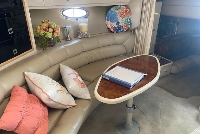 Luxurious 1995 Regal 402 yacht interior with plush seating and elegant decor.