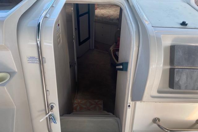 Entrance to cabin of 1995 Regal 402 boat, showing interior steps and doorway.