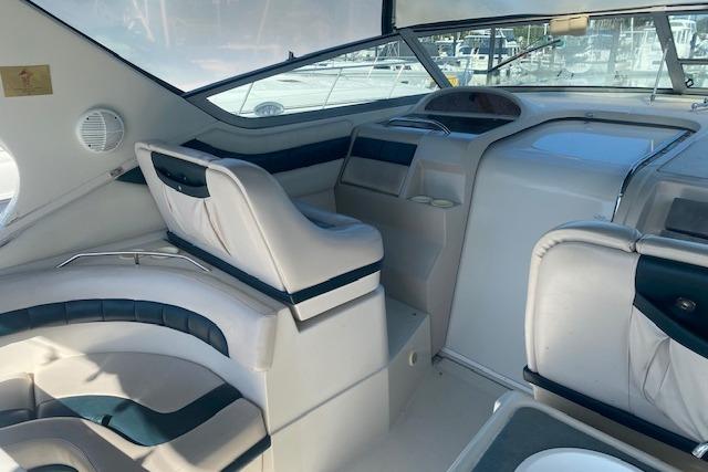 Interior of a 1995 Regal 402 boat, featuring plush seating and modern design.