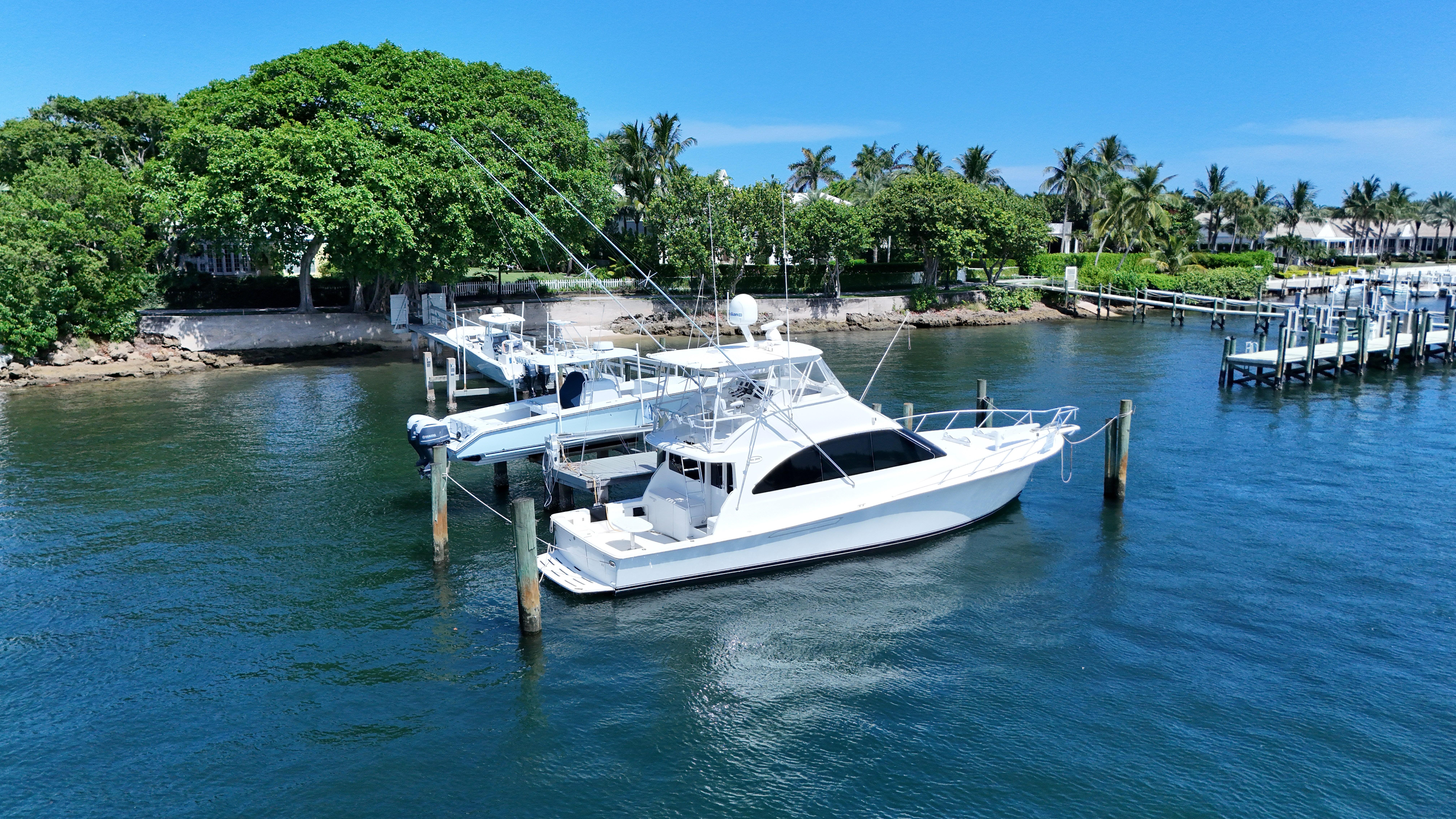 Ocean Yachts-52 SUPER SPORT 2002-No Name SC-US-2002 Ocean Yachts 52 SUPER SPORT docked in a scenic marina with lush greenery.-9557435 | Thumbnail