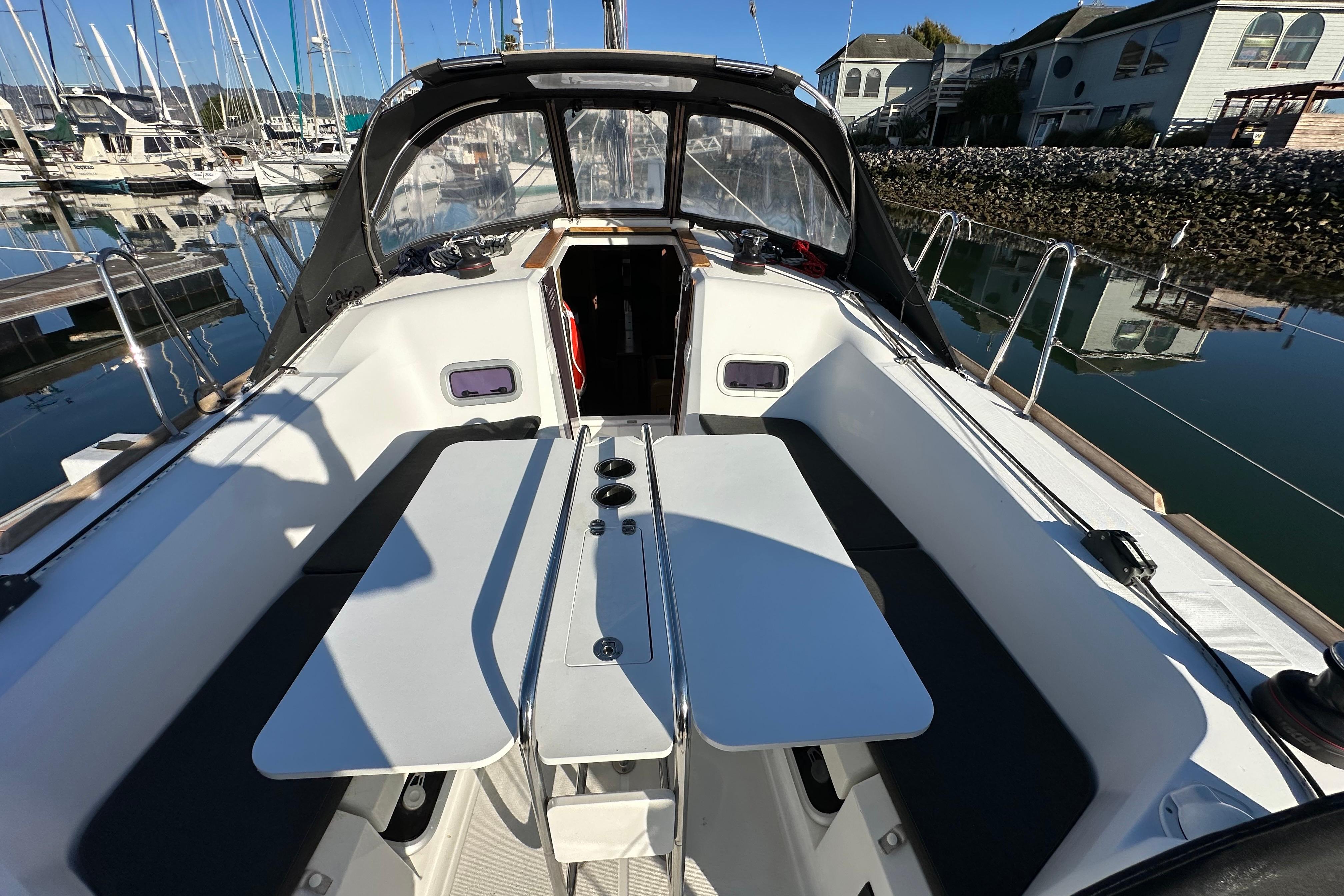 Cockpit of 2021 Jeanneau Sun Odyssey 349 sailboat docked at marina.