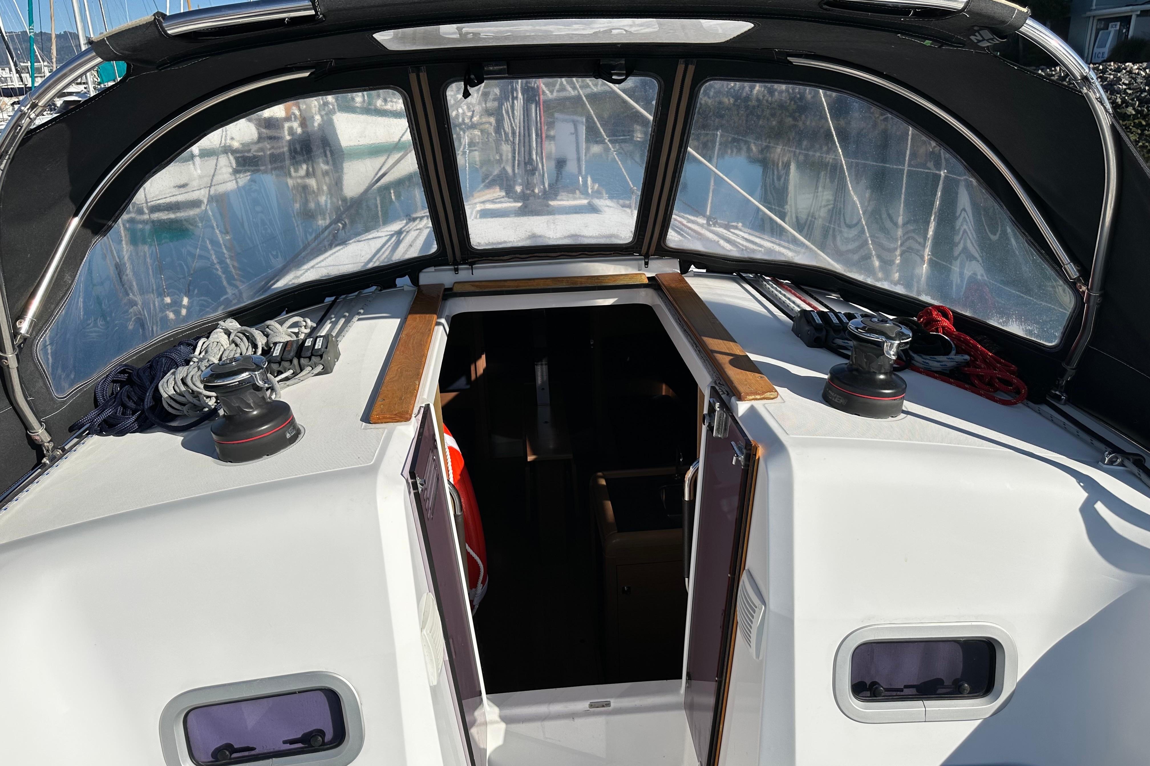 2021 Jeanneau Sun Odyssey 349 cockpit with open hatch and winches.