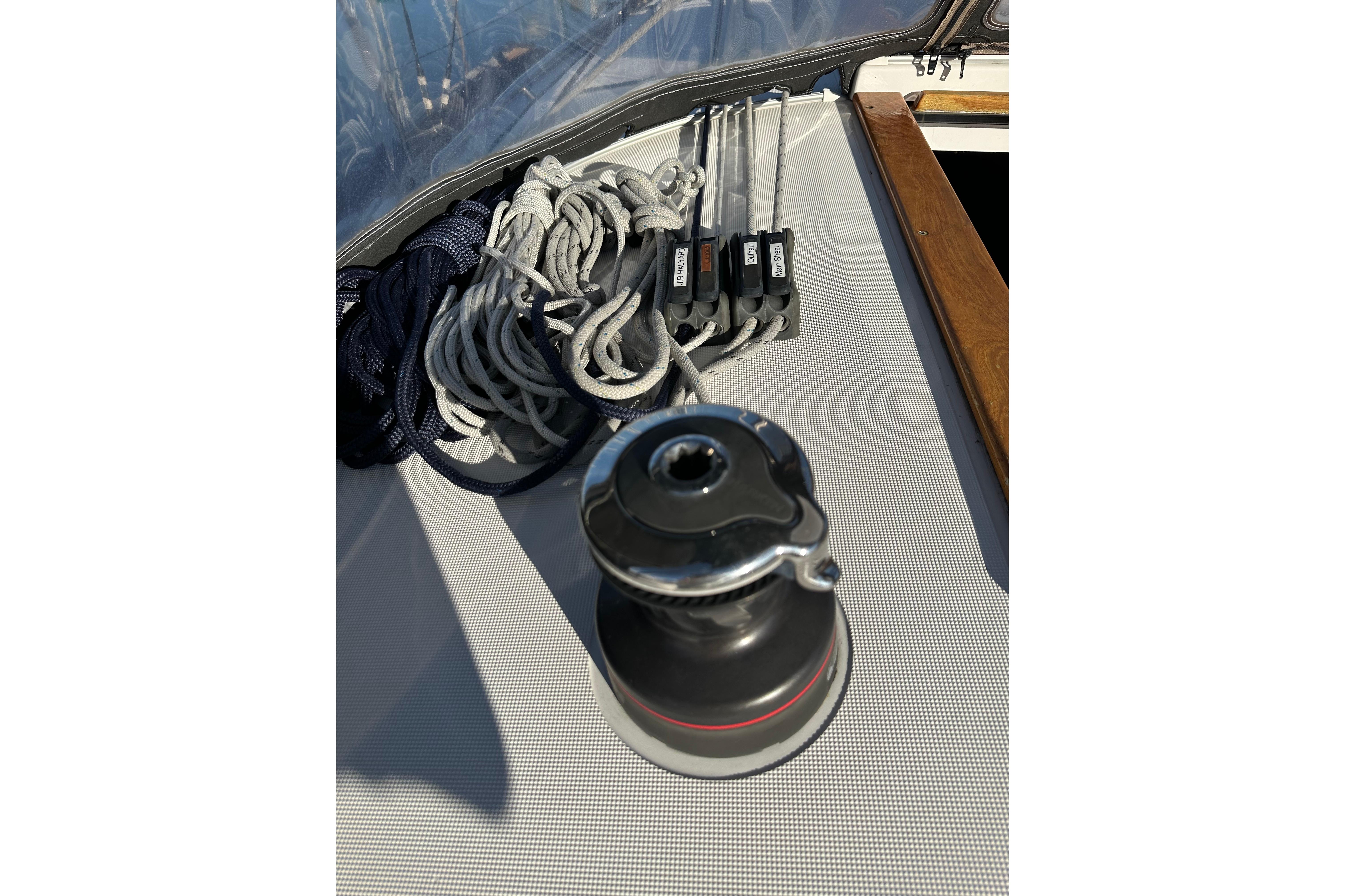Winch and ropes on Jeanneau Sun Odyssey 349 sailboat deck, 2021 model.