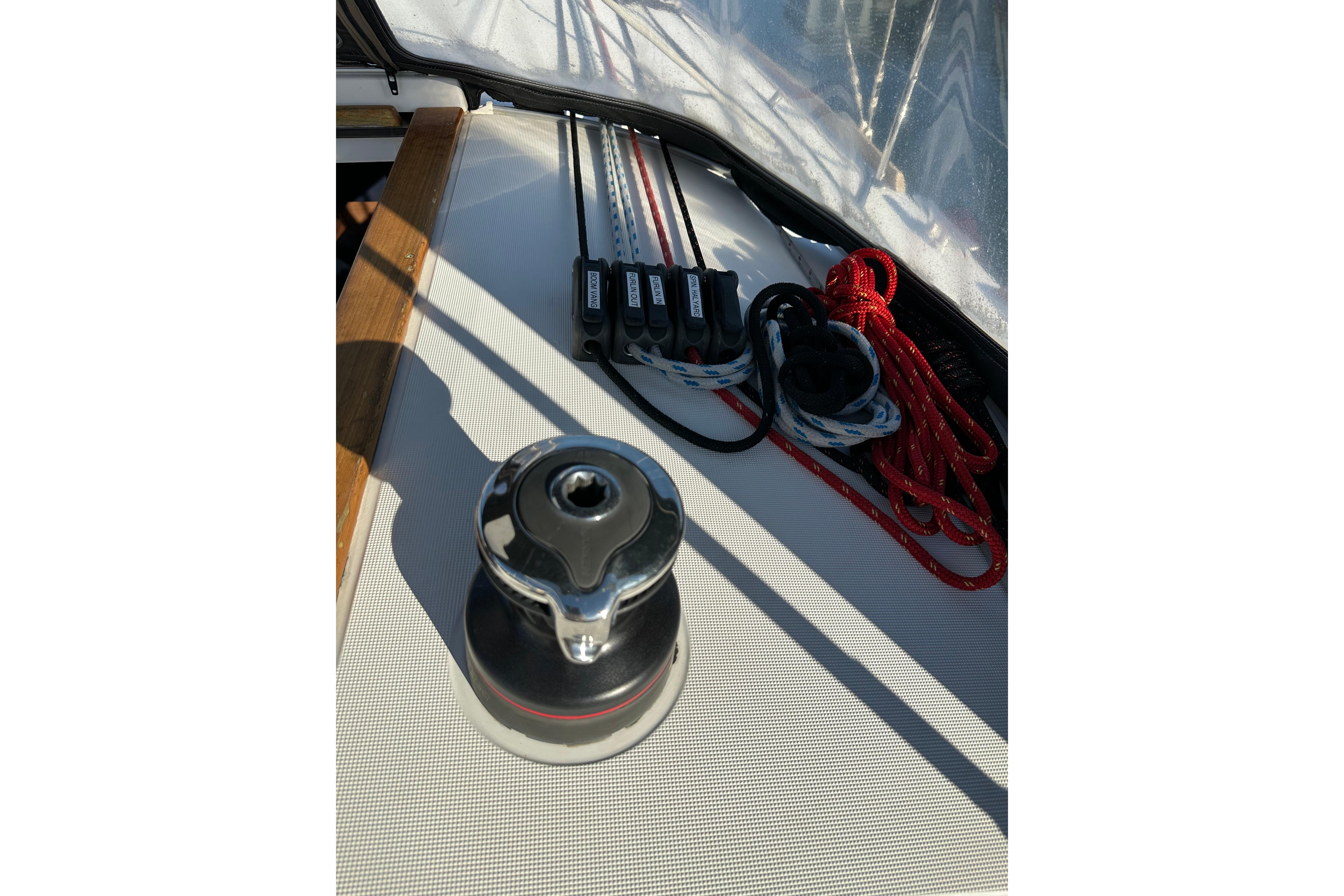 Winch and ropes on 2021 Jeanneau Sun Odyssey 349 sailboat deck.
