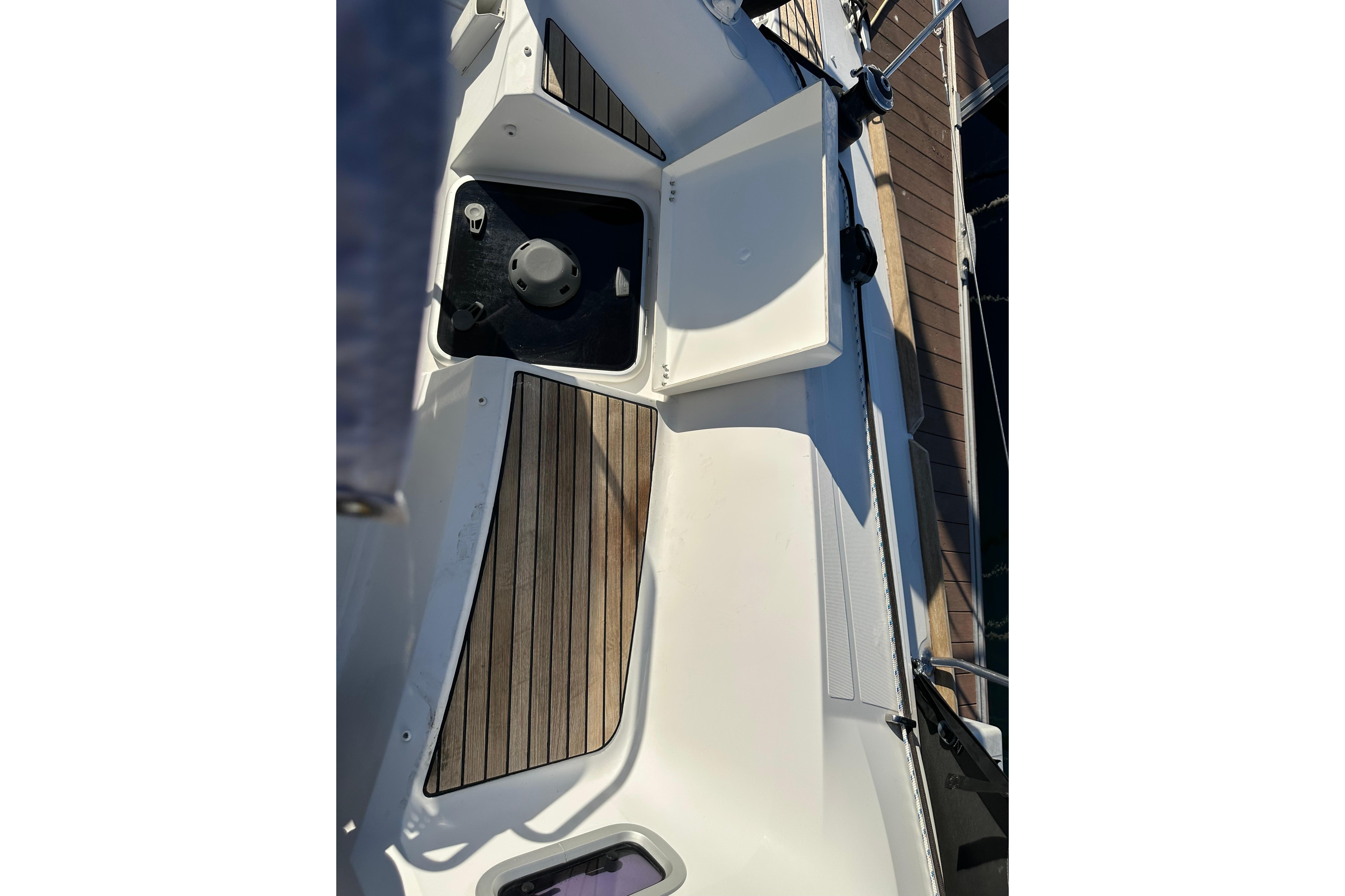 2021 Jeanneau Sun Odyssey 349 deck with wood accents and sleek design.