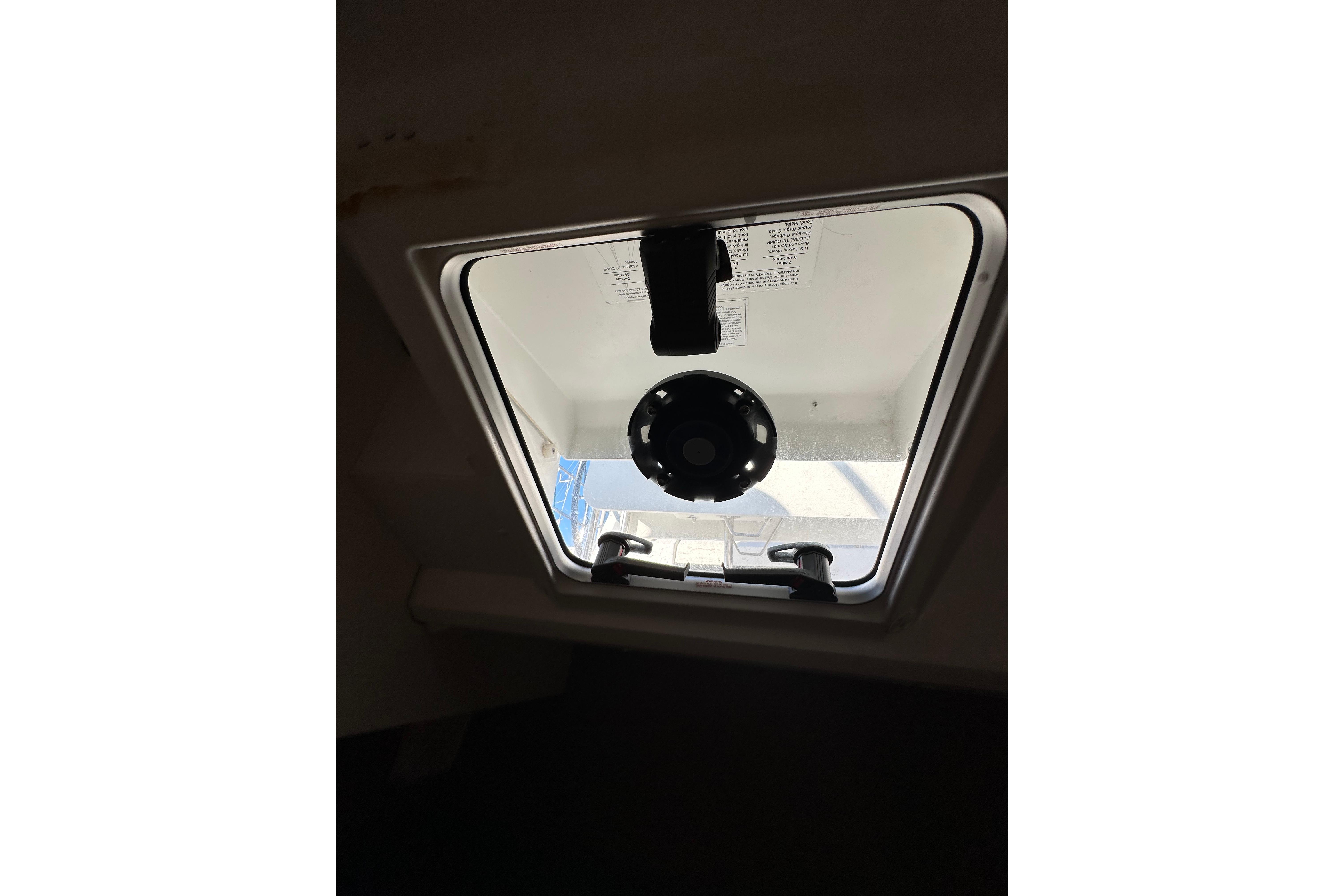 Hatch window of 2021 Jeanneau Sun Odyssey 349 sailboat, interior view.