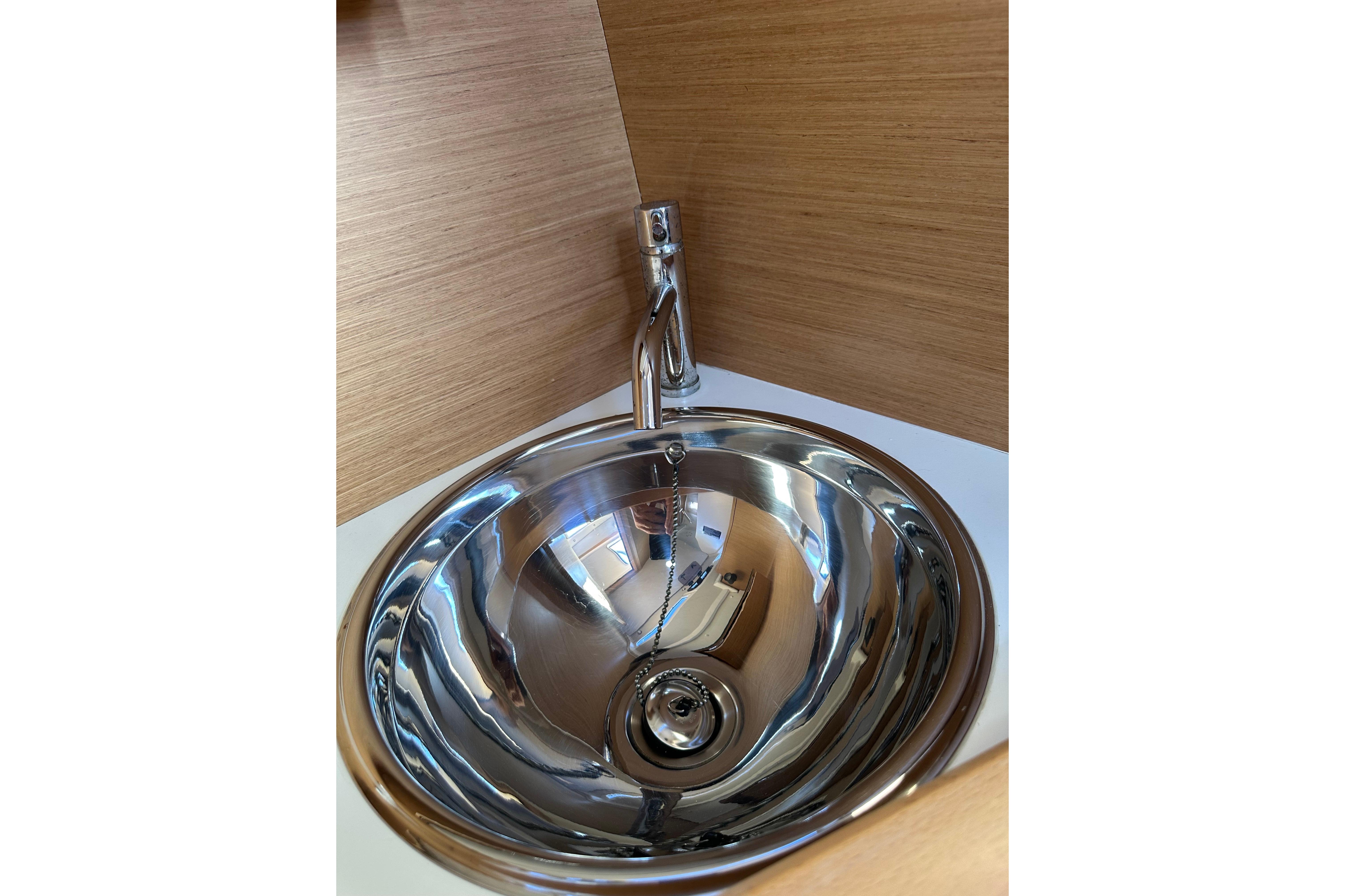 Stainless steel sink in Jeanneau Sun Odyssey 349 yacht, 2021 model.