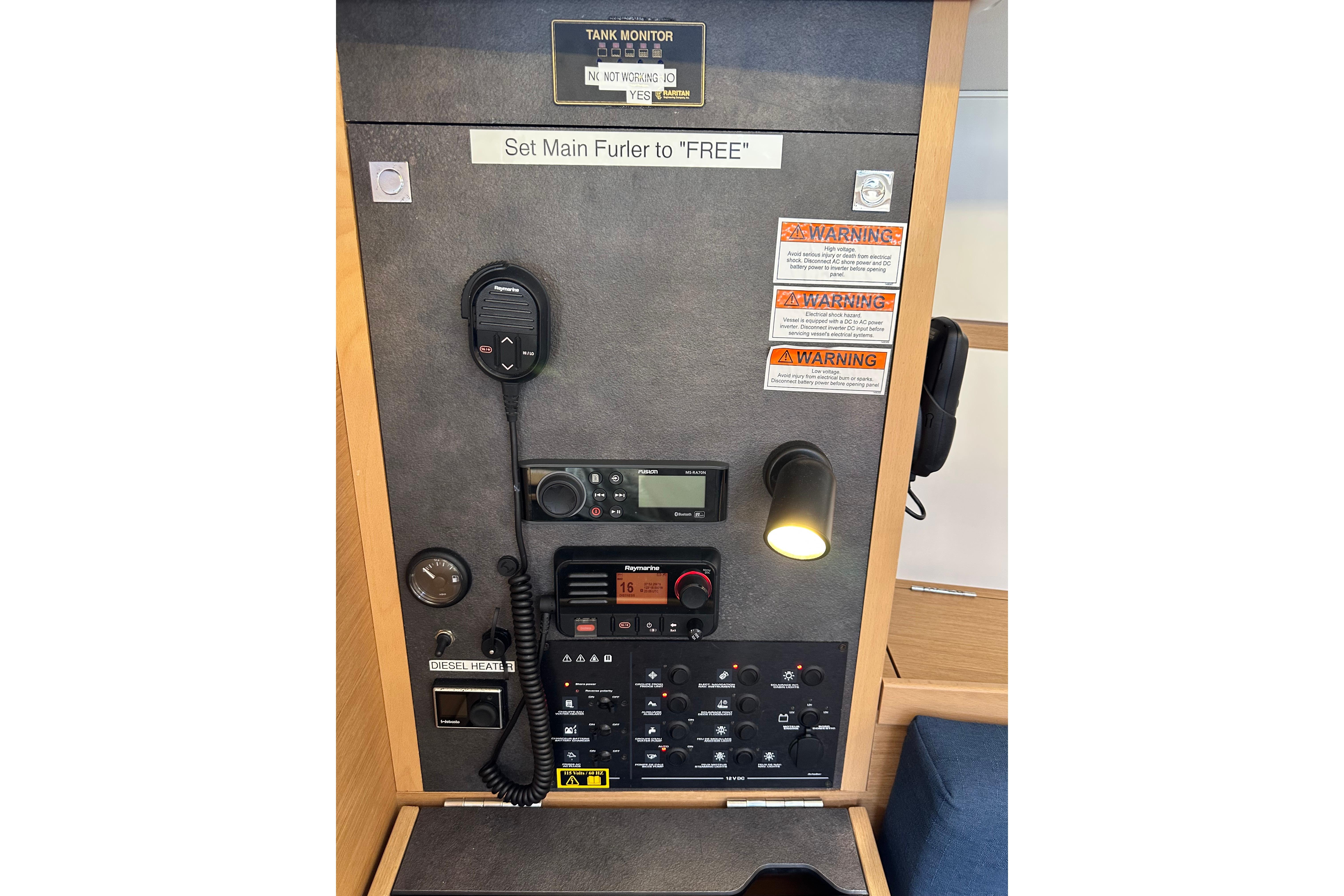 Control panel of 2021 Jeanneau Sun Odyssey 349 sailboat with communication equipment.