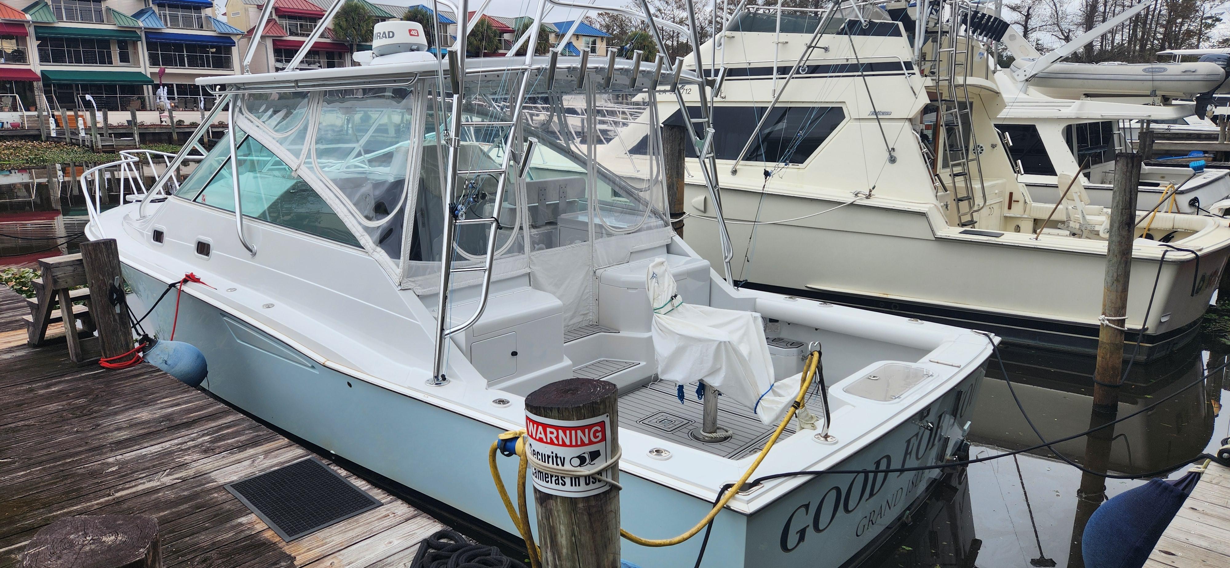 Cabo-35 Express 1995 -AL-US-1995 Cabo 35 Express boat docked at marina, featuring sleek design and spacious deck.-9547451 | Thumbnail