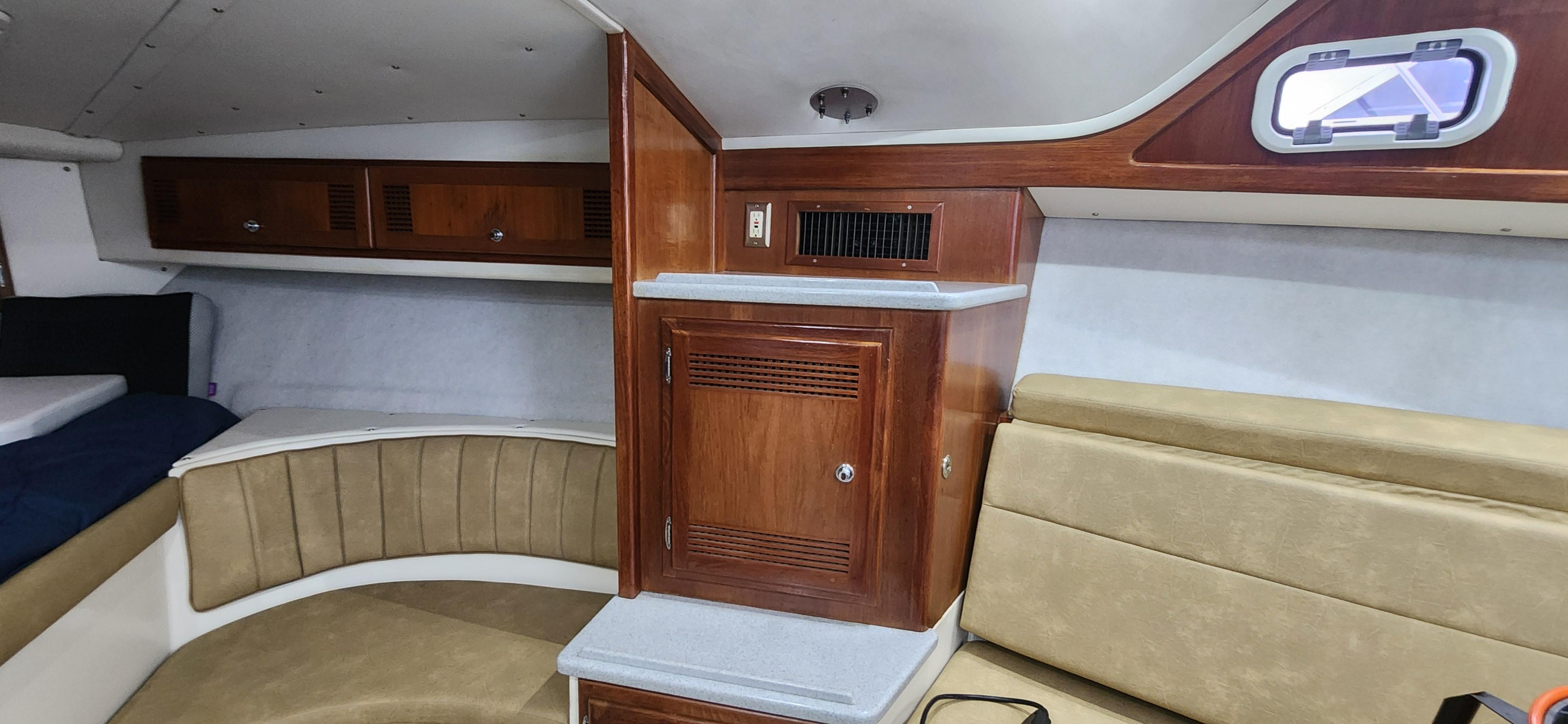 Cabo-35 Express 1995 -AL-US-Interior of 1995 Cabo 35 Express boat with wood cabinetry and seating.-9547451 | Thumbnail