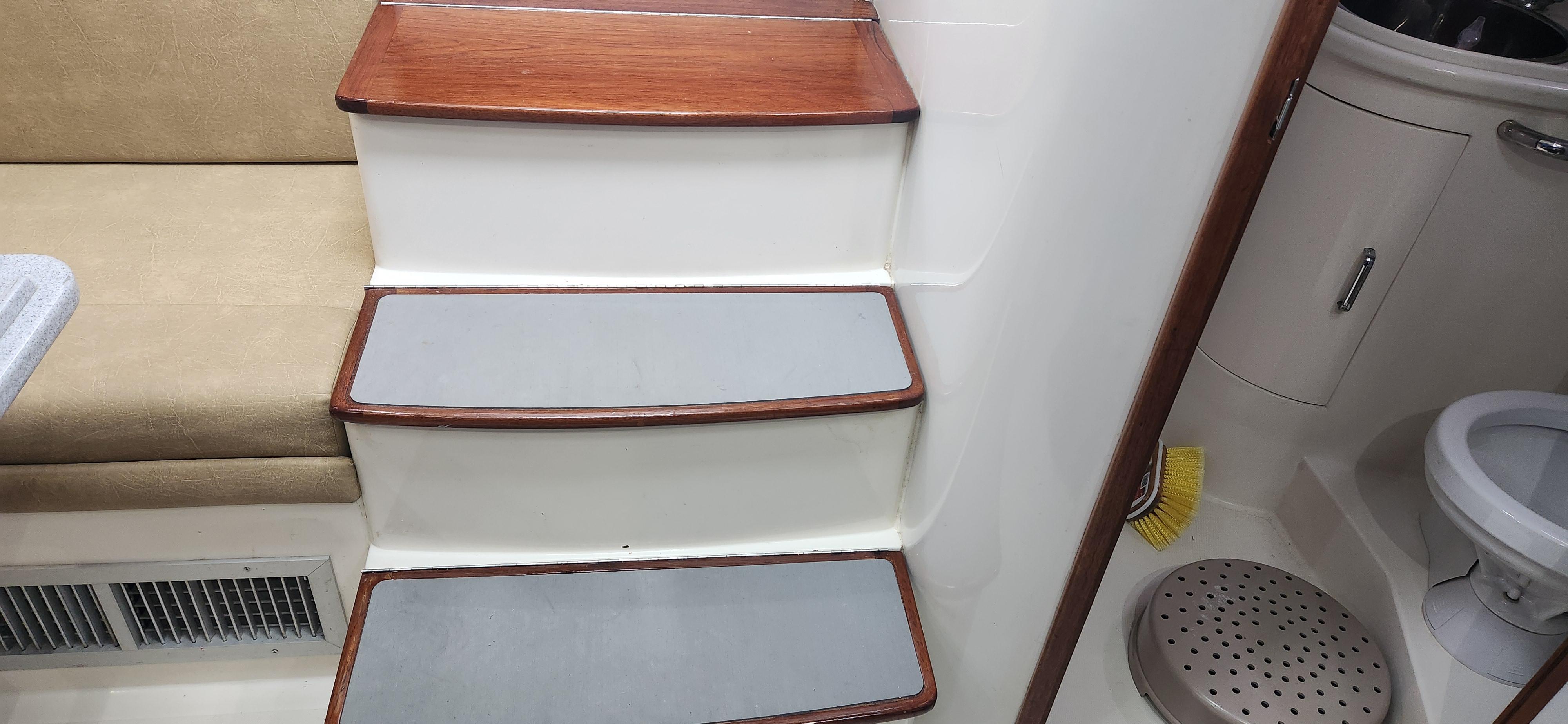 Cabo-35 Express 1995 -AL-US-Interior of 1995 Cabo 35 Express boat showing stairs and bathroom area.-9547451 | Thumbnail