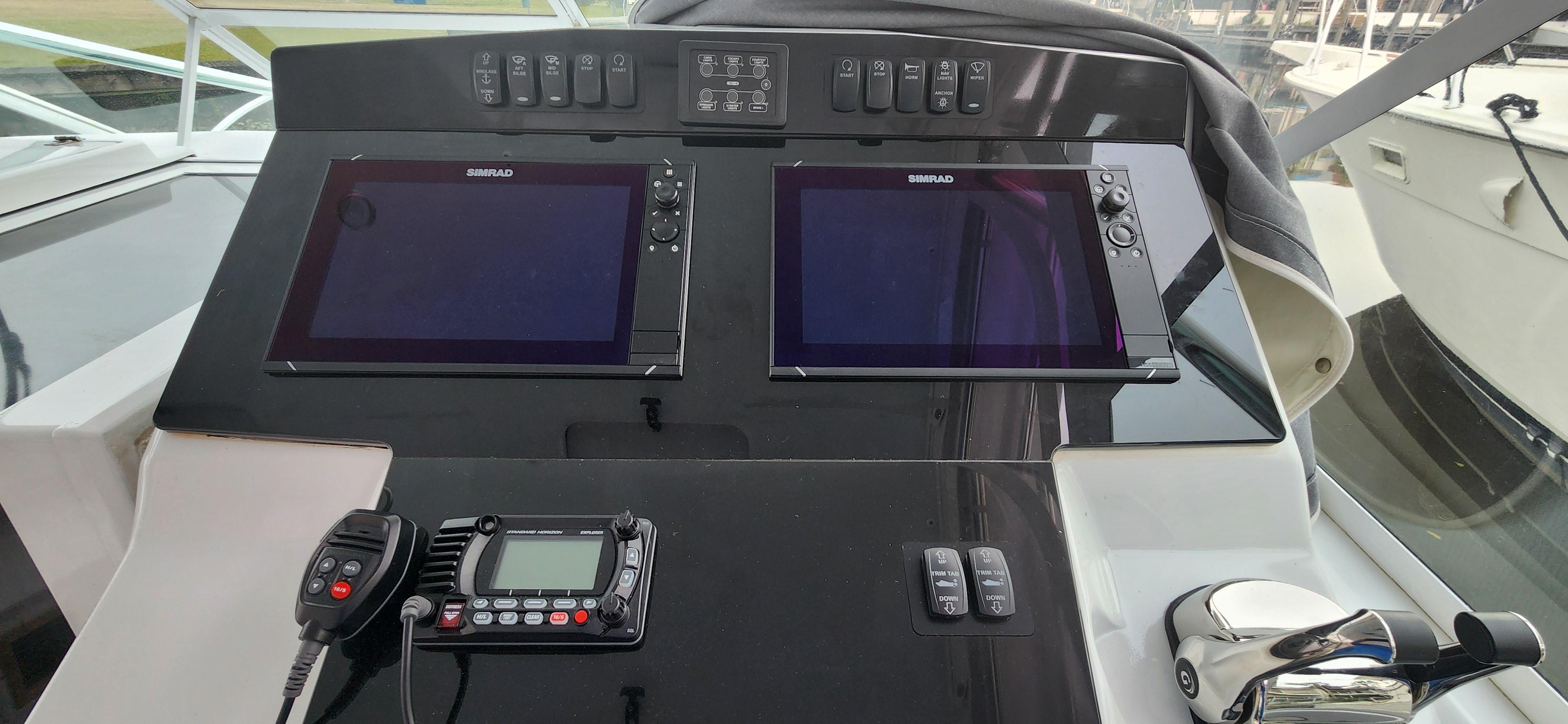 Cabo-35 Express 1995 -AL-US-Control panel of a 1995 Cabo 35 Express boat with dual Simrad displays.-9547451 | Thumbnail