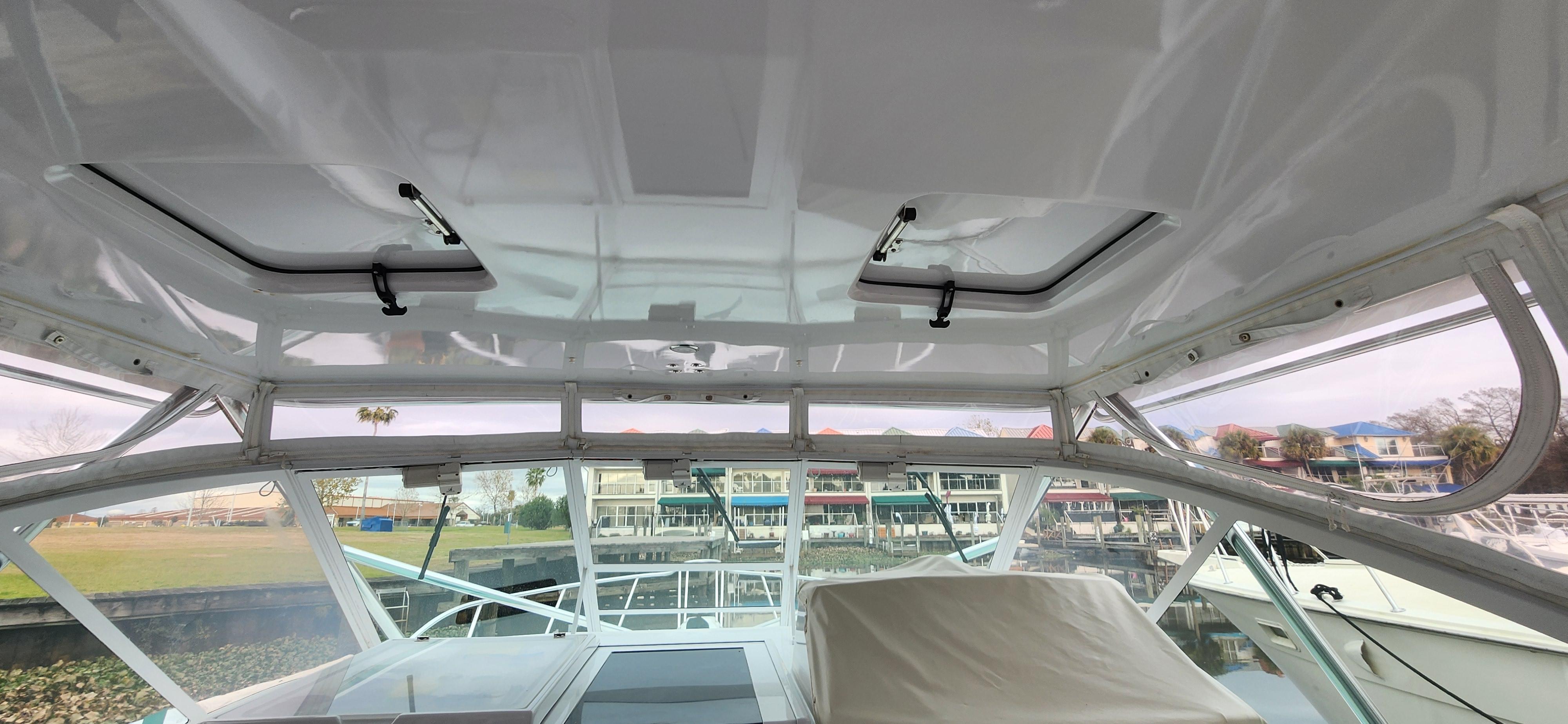 Cabo-35 Express 1995 -AL-US-Interior view of a 1995 Cabo 35 Express boat with marina background.-9547451 | Thumbnail