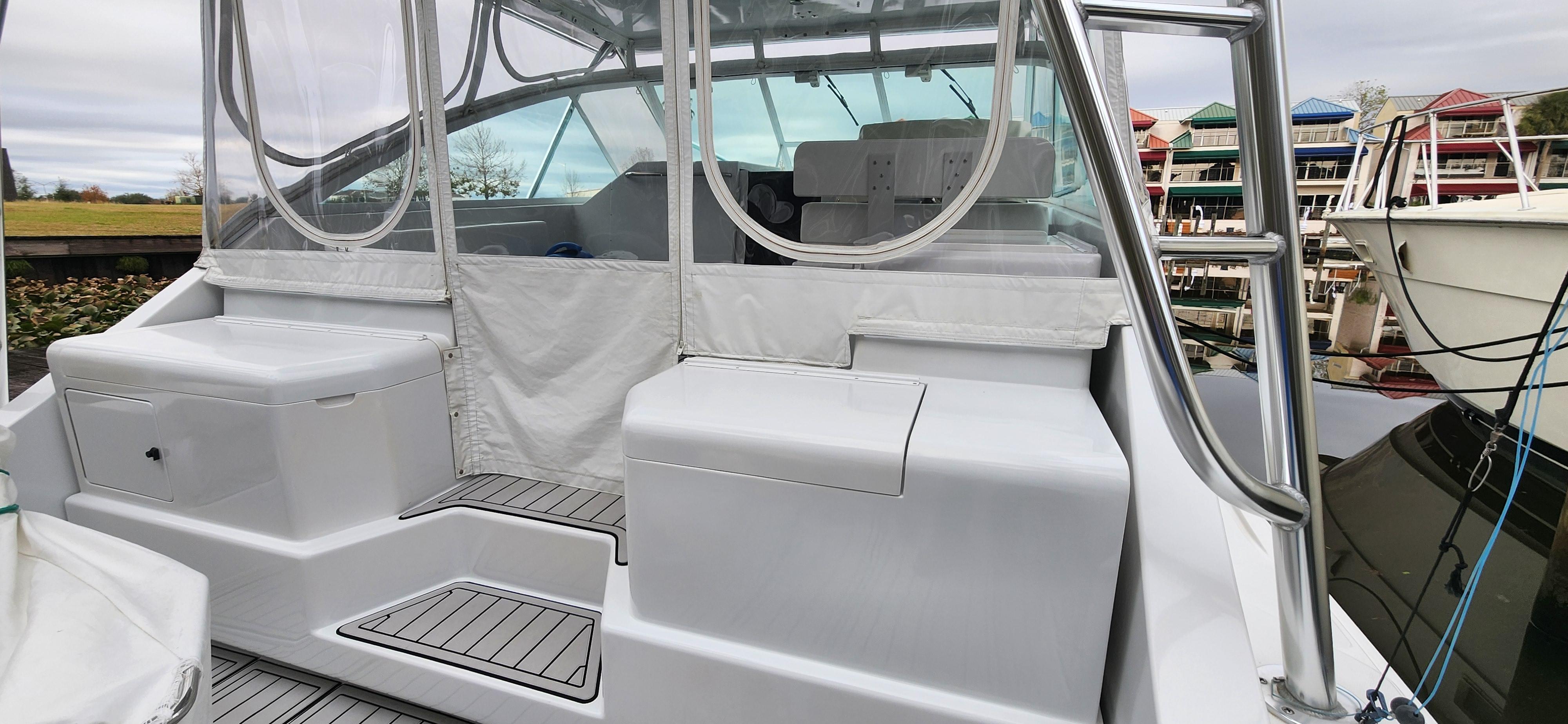 Cabo-35 Express 1995 -AL-US-1995 Cabo 35 Express boat with covered seating and marina background.-9547451 | Thumbnail