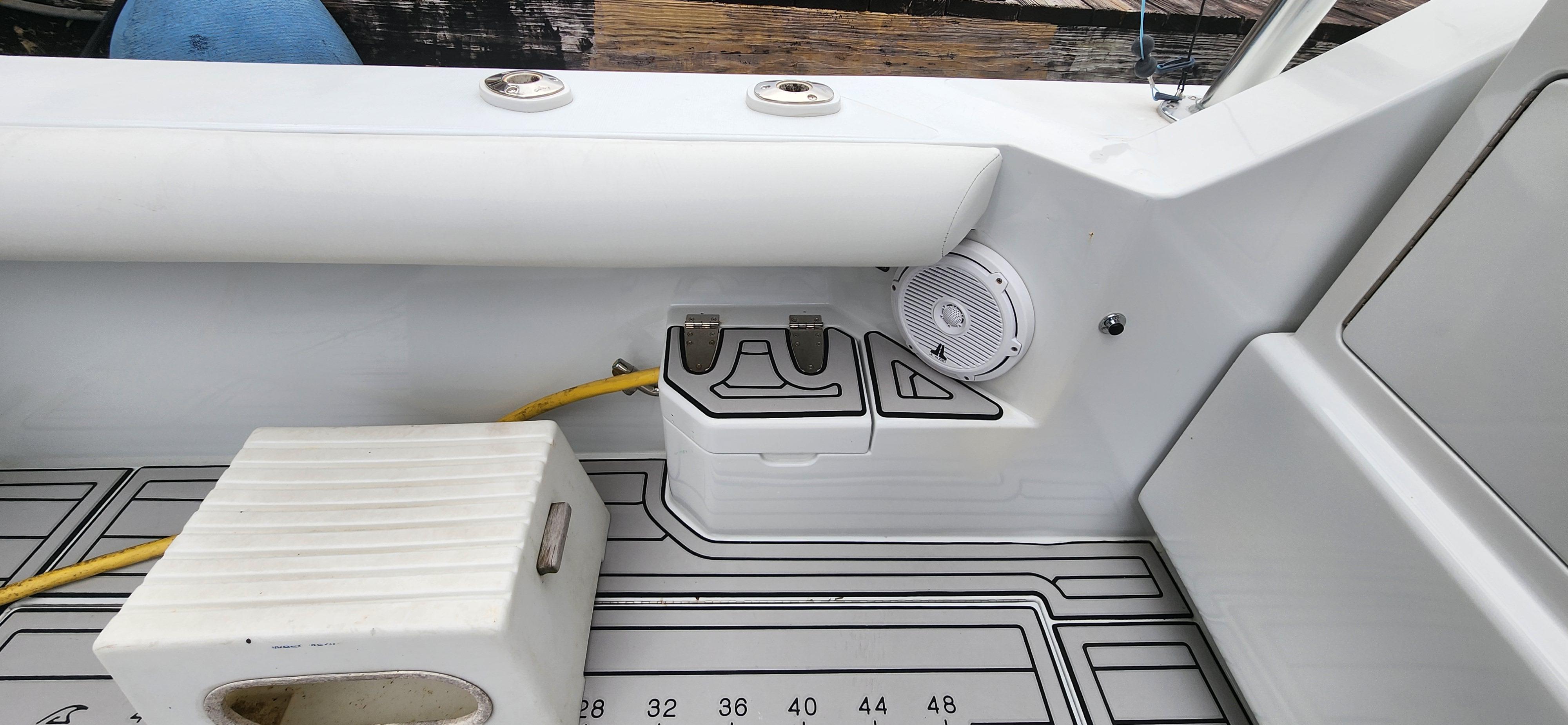 Cabo-35 Express 1995 -AL-US-1995 Cabo 35 Express boat interior with speaker and storage compartment.-9547451 | Thumbnail