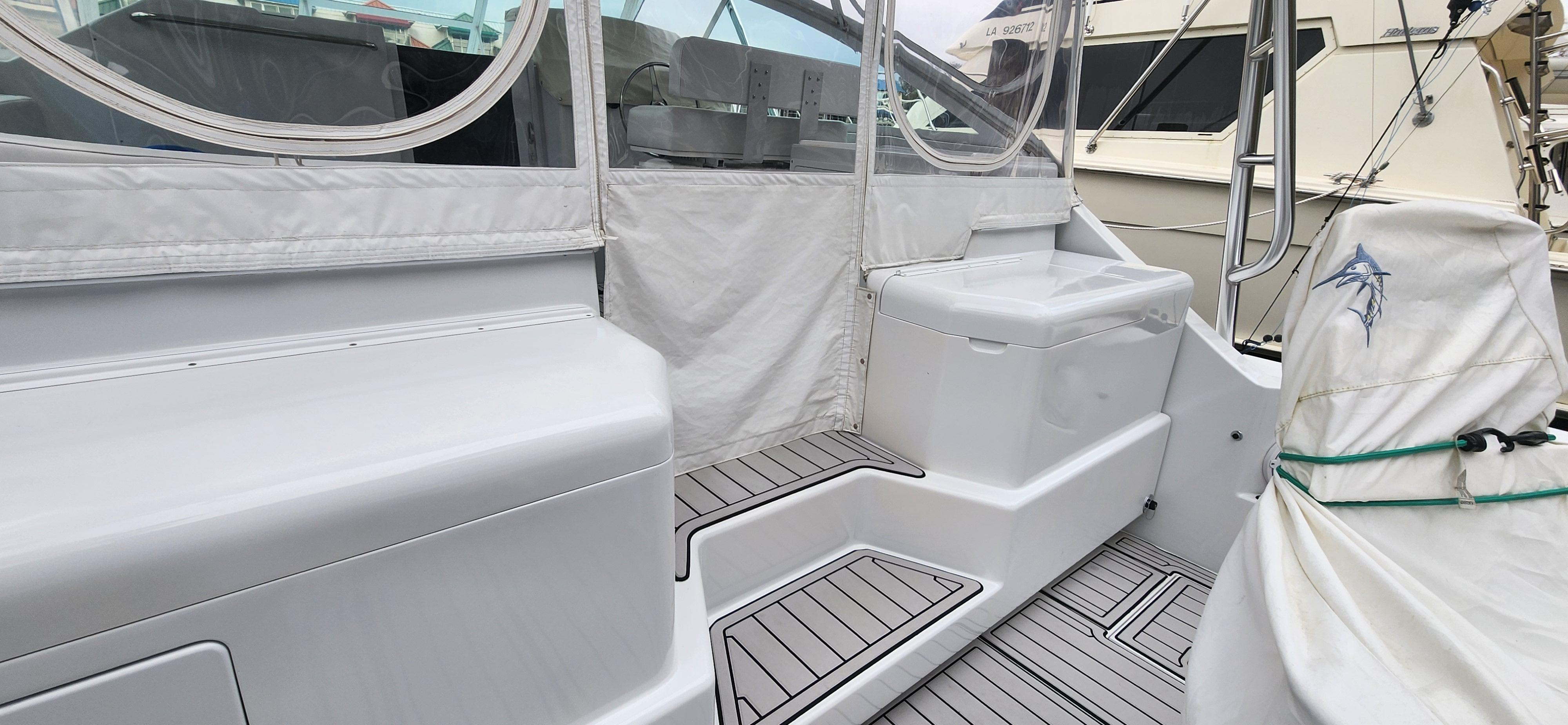 Cabo-35 Express 1995 -AL-US-1995 Cabo 35 Express boat interior with seating and covered deck area.-9547451 | Thumbnail
