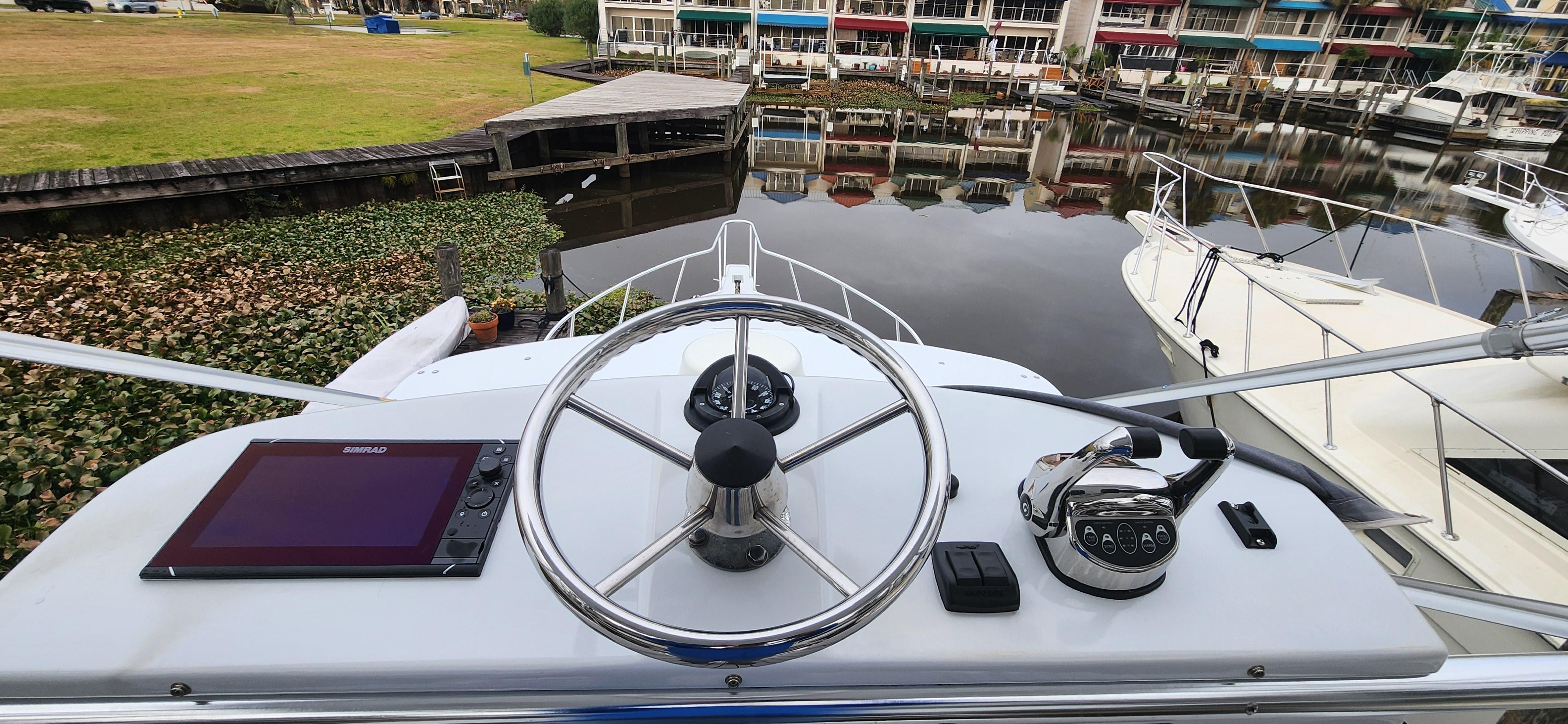 Cabo-35 Express 1995 -AL-US-Helm of 1995 Cabo 35 Express boat with steering wheel and navigation equipment.-9547451 | Thumbnail