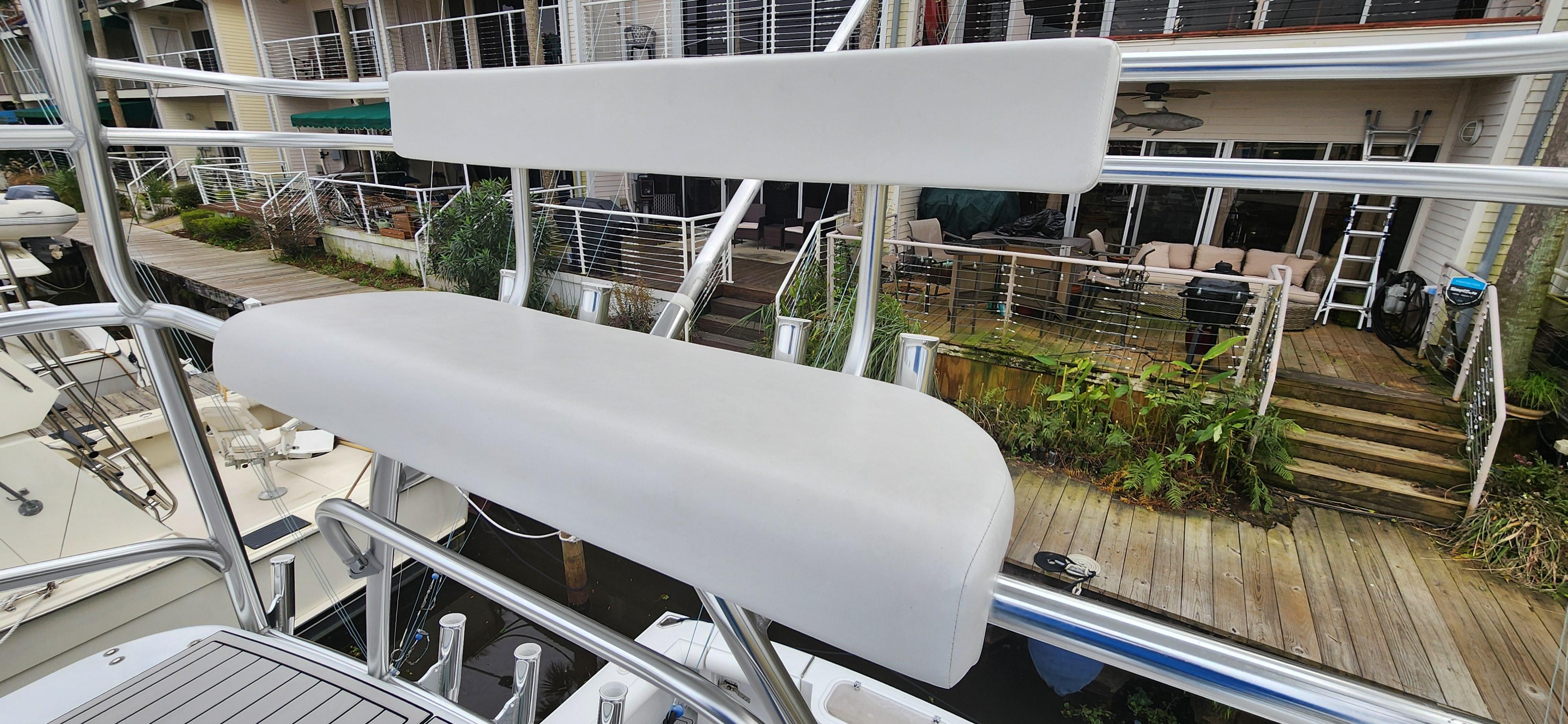 Cabo-35 Express 1995 -AL-US-1995 Cabo 35 Express boat with white seating on deck, dockside view.-9547451 | Thumbnail