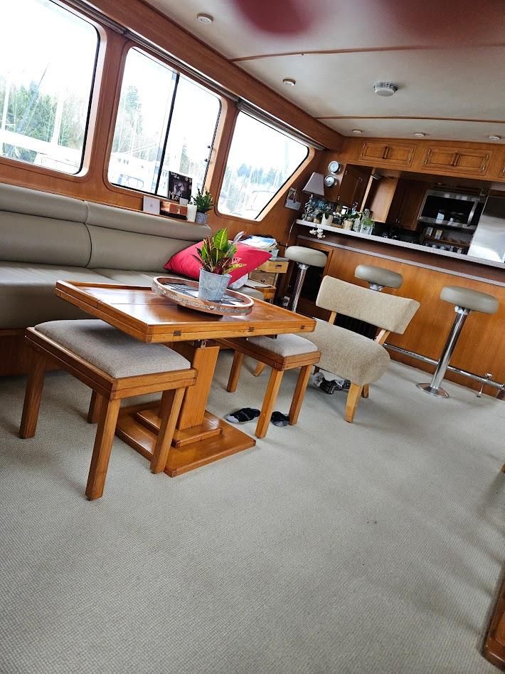 DeFever-53 POC 1987 -WA-US-Interior of 1987 DeFever 53 POC yacht with dining area and bar stools.-9787461 | Thumbnail