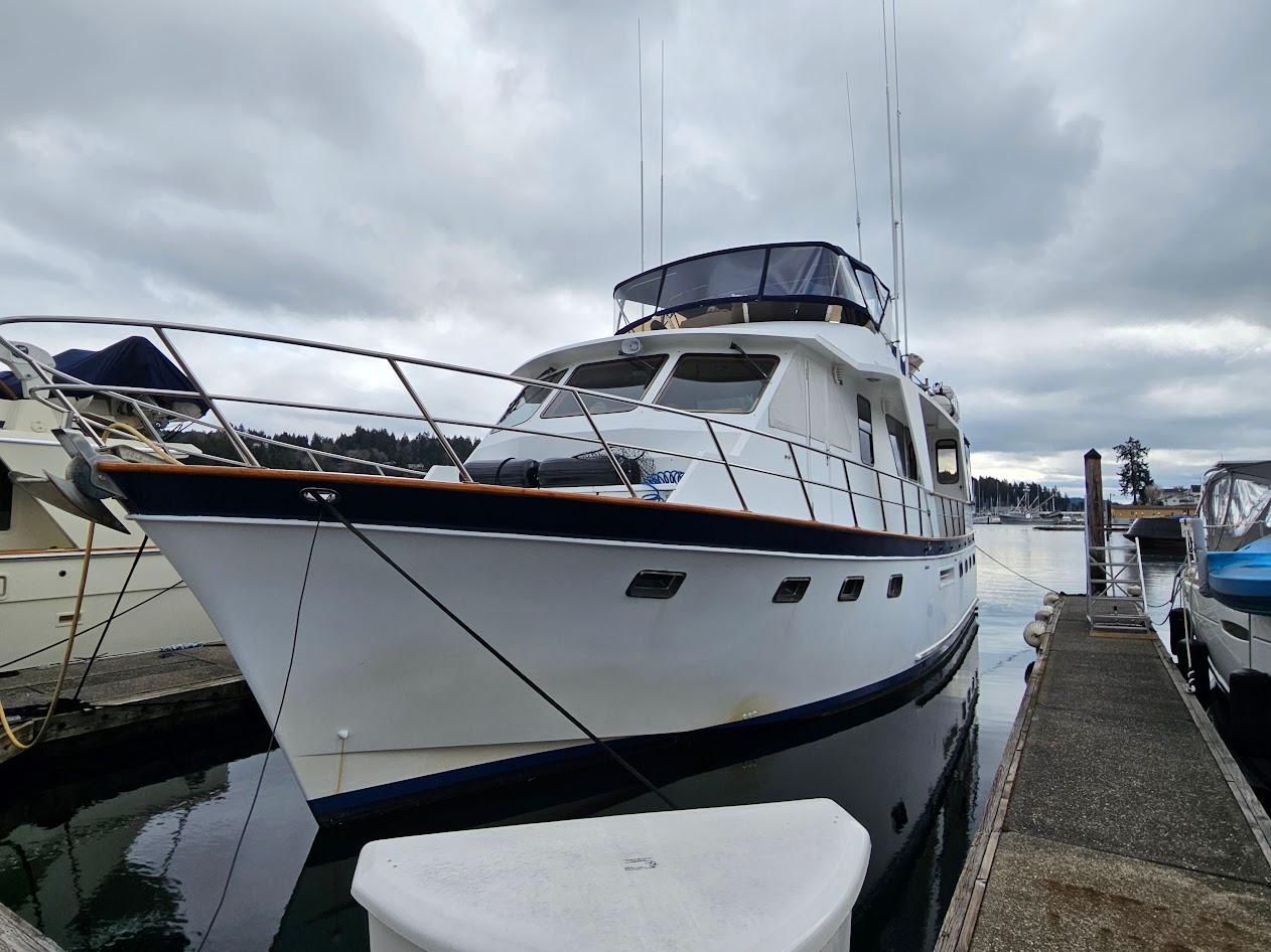 DeFever-53 POC 1987 -WA-US-1987 DeFever 53 POC yacht docked at marina under cloudy sky.-9787461