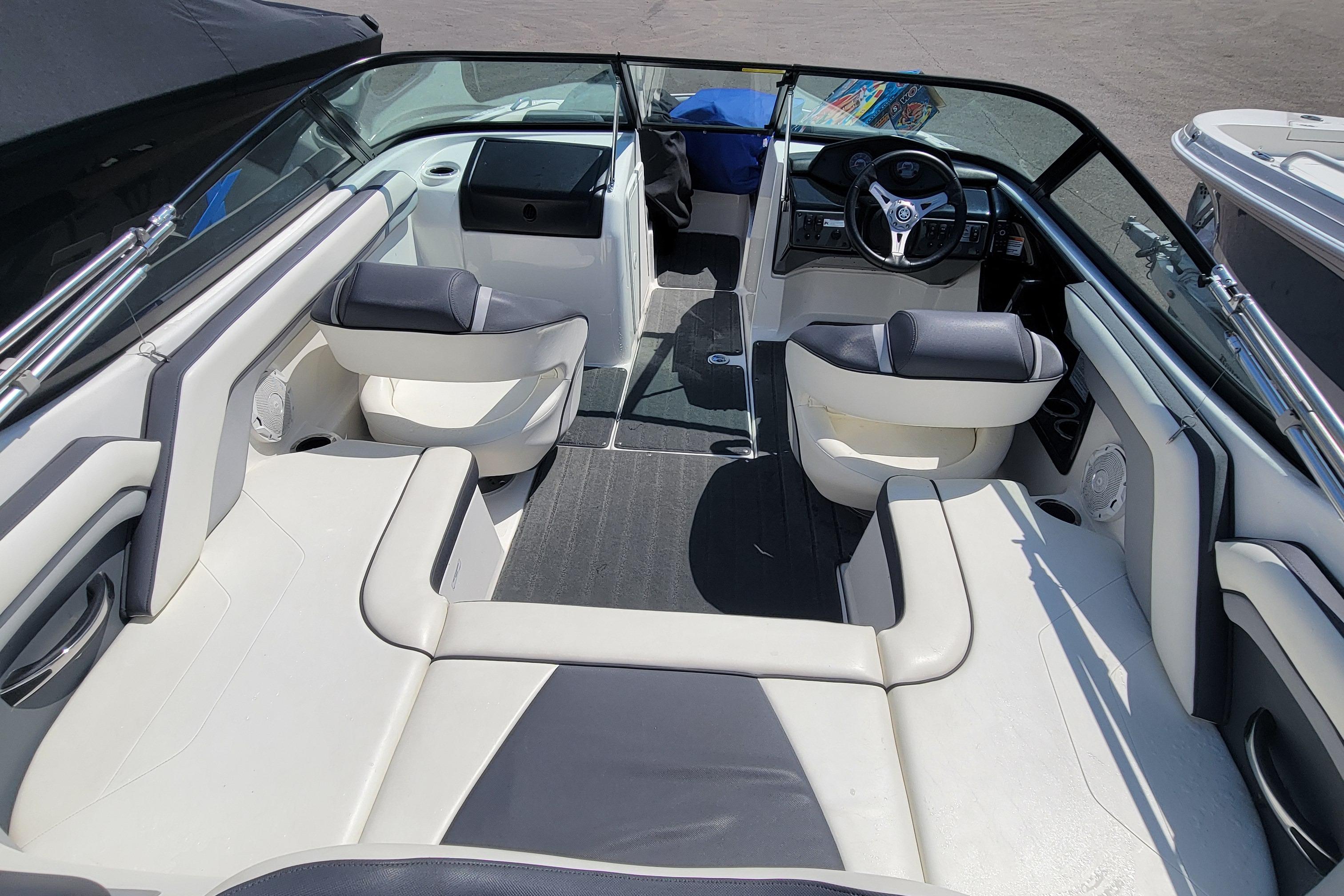 2016 Yamaha Boats SX192 interior with seating and steering wheel, showcasing modern design.