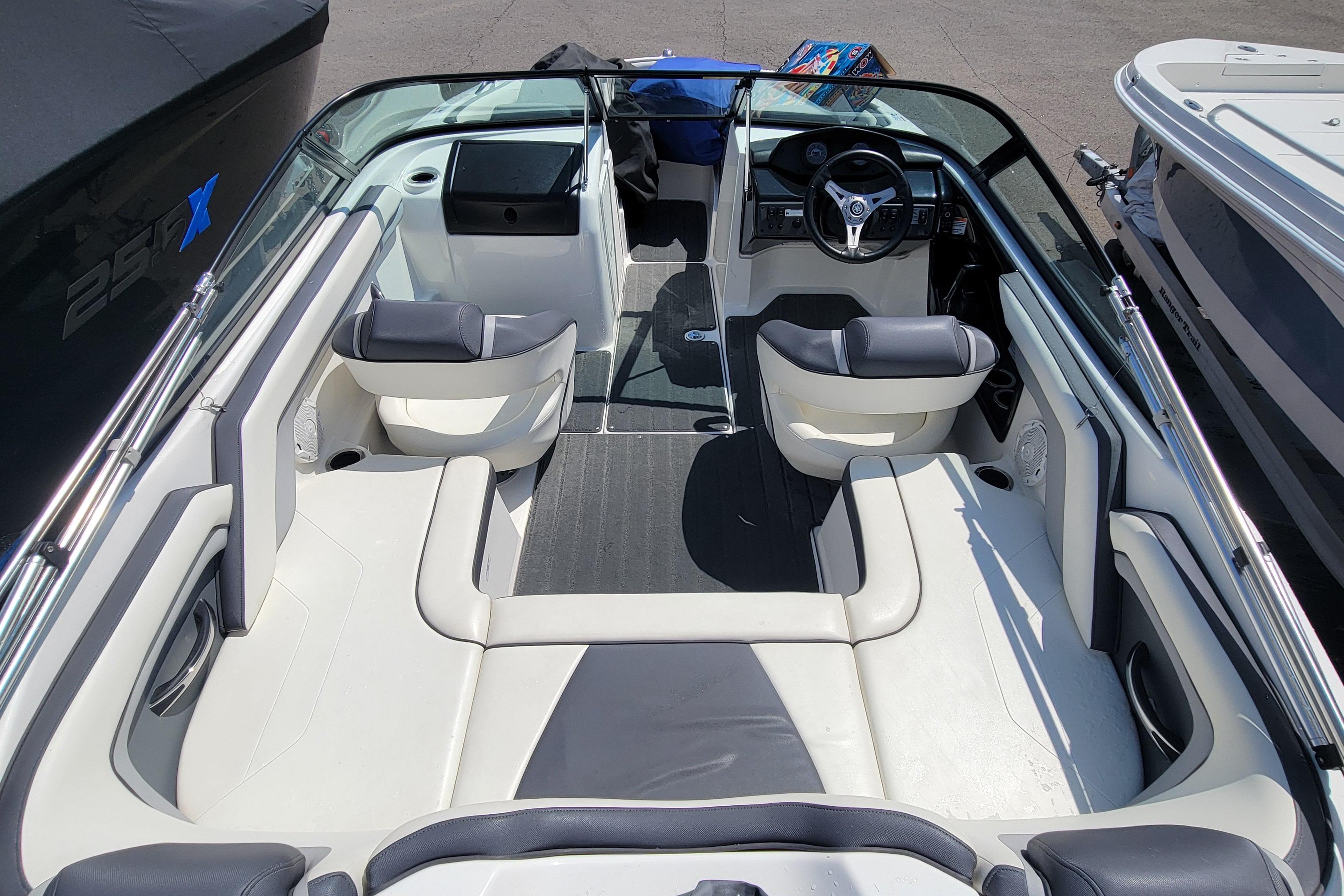 2016 Yamaha Boats SX192 interior with seating and steering wheel, showcasing sleek design and comfort.