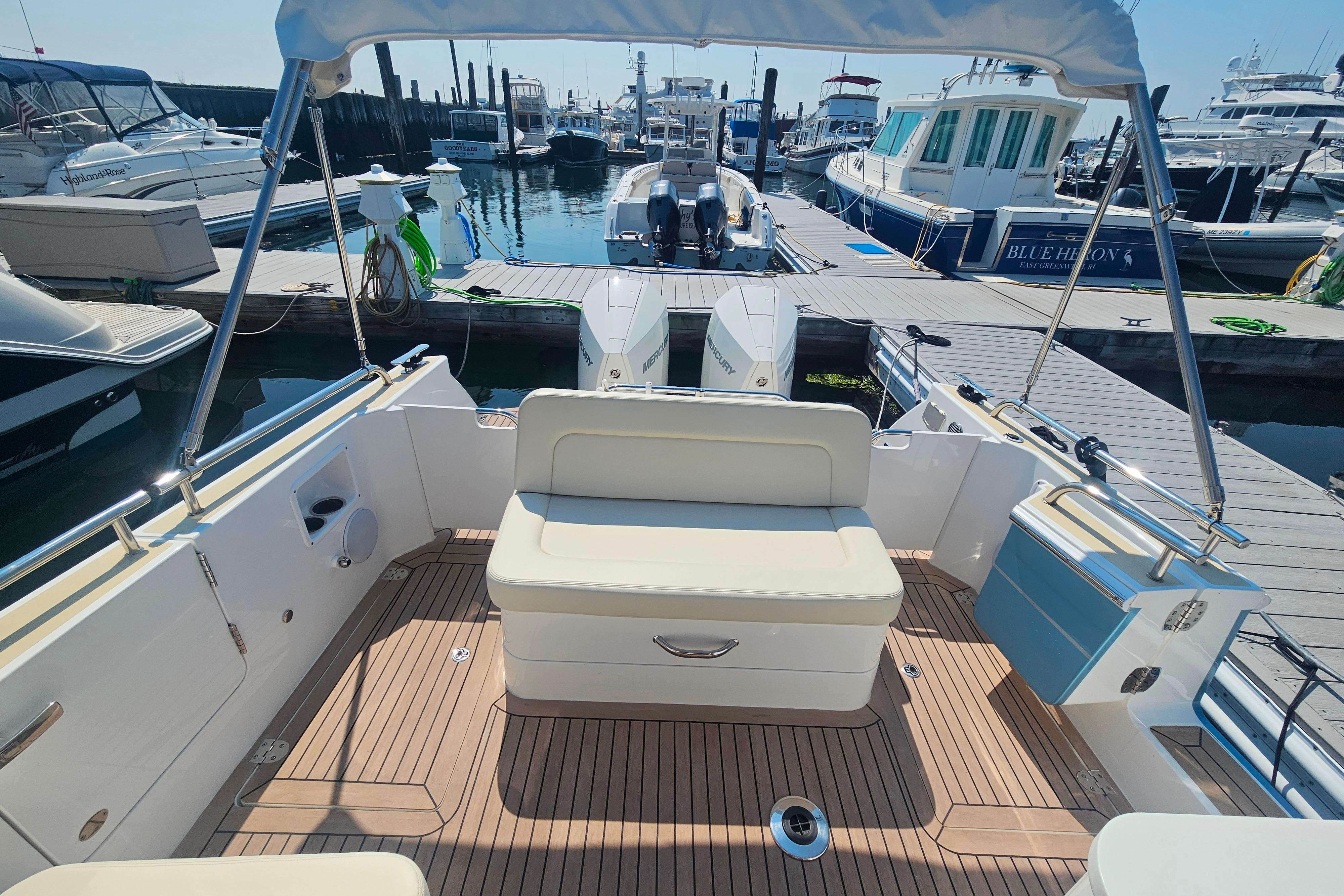 2023 MJM 35 boat interior with seating, docked at marina.