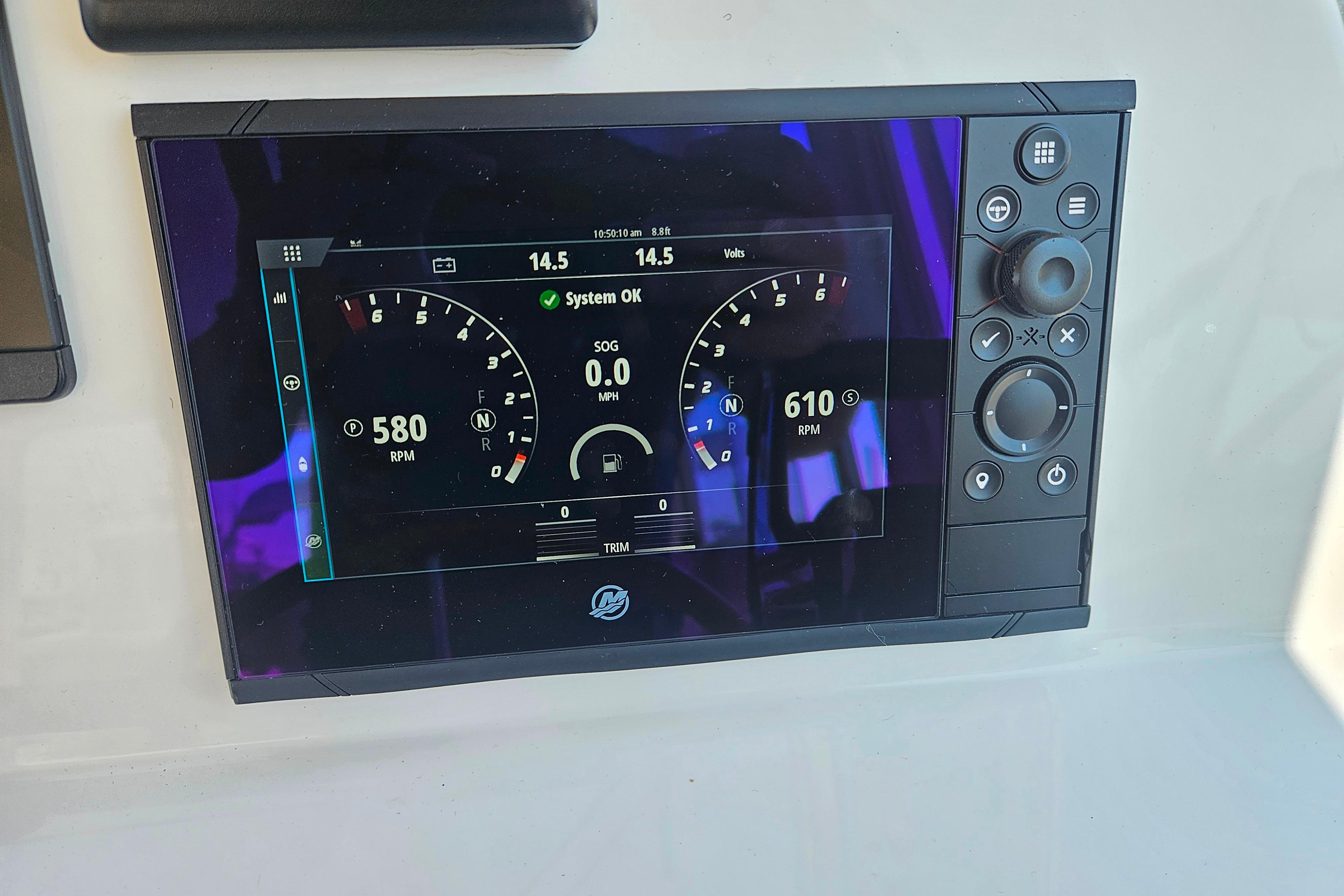 Digital dashboard display on 2023 MJM 35 boat showing RPM and system status.