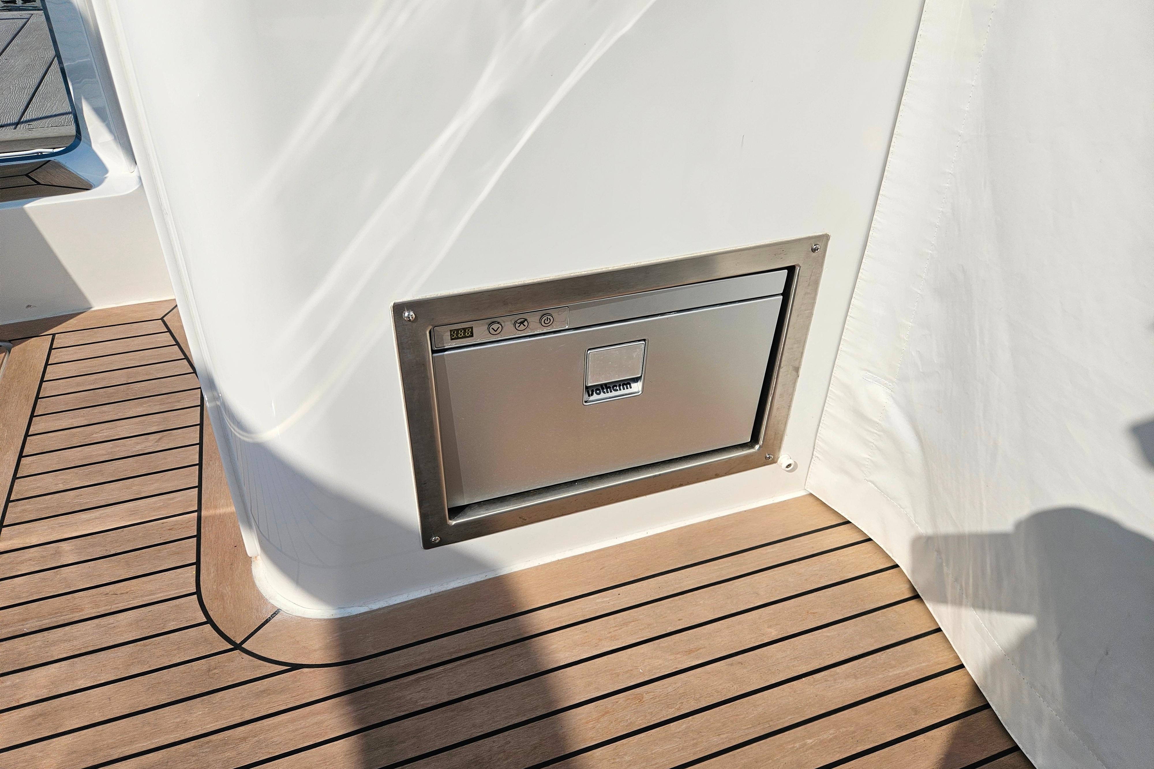 Built-in stainless steel drawer on 2023 MJM 35 yacht with teak flooring.