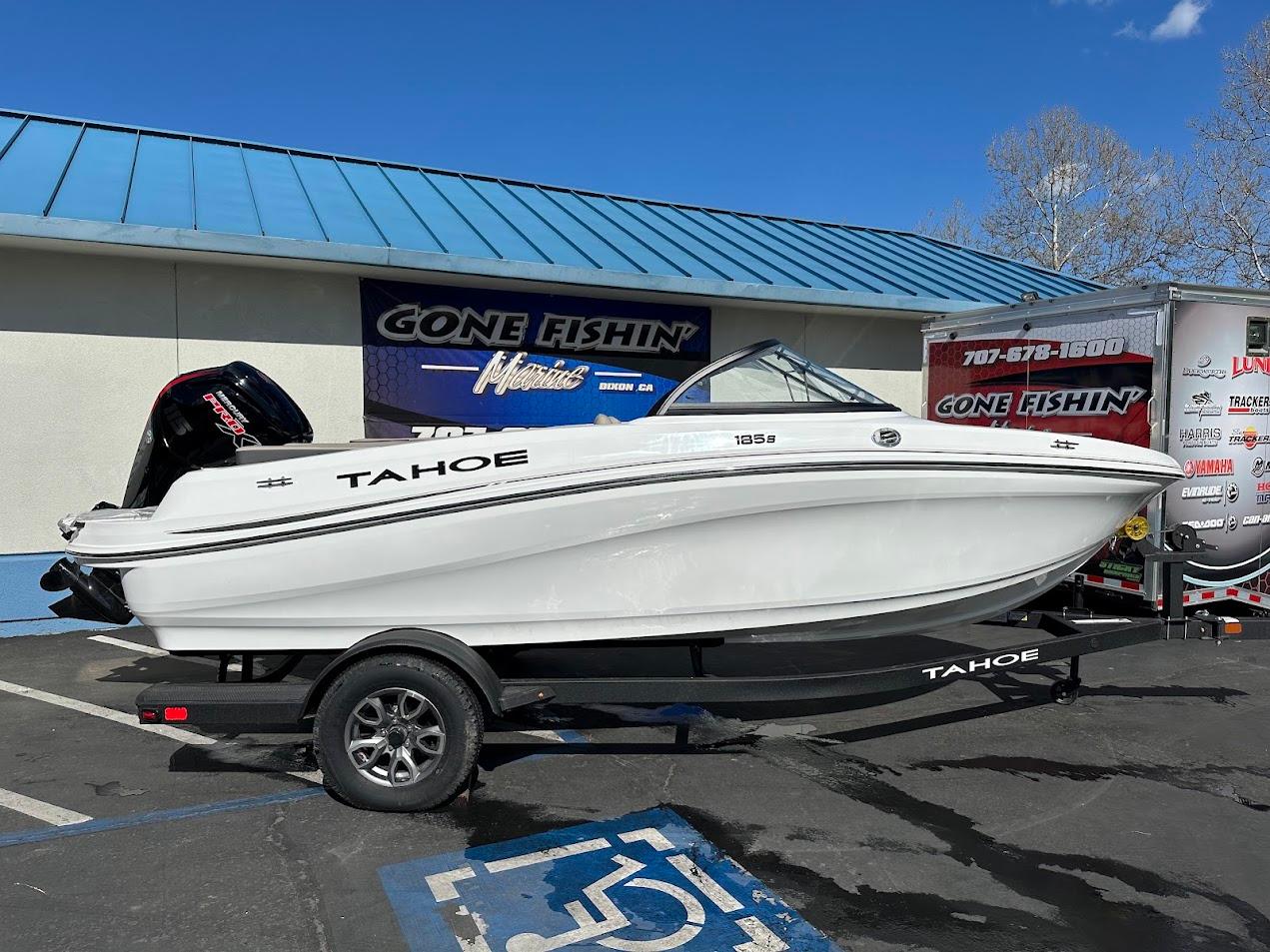 2025 Tahoe 185 S boat on trailer, parked outside a store with 