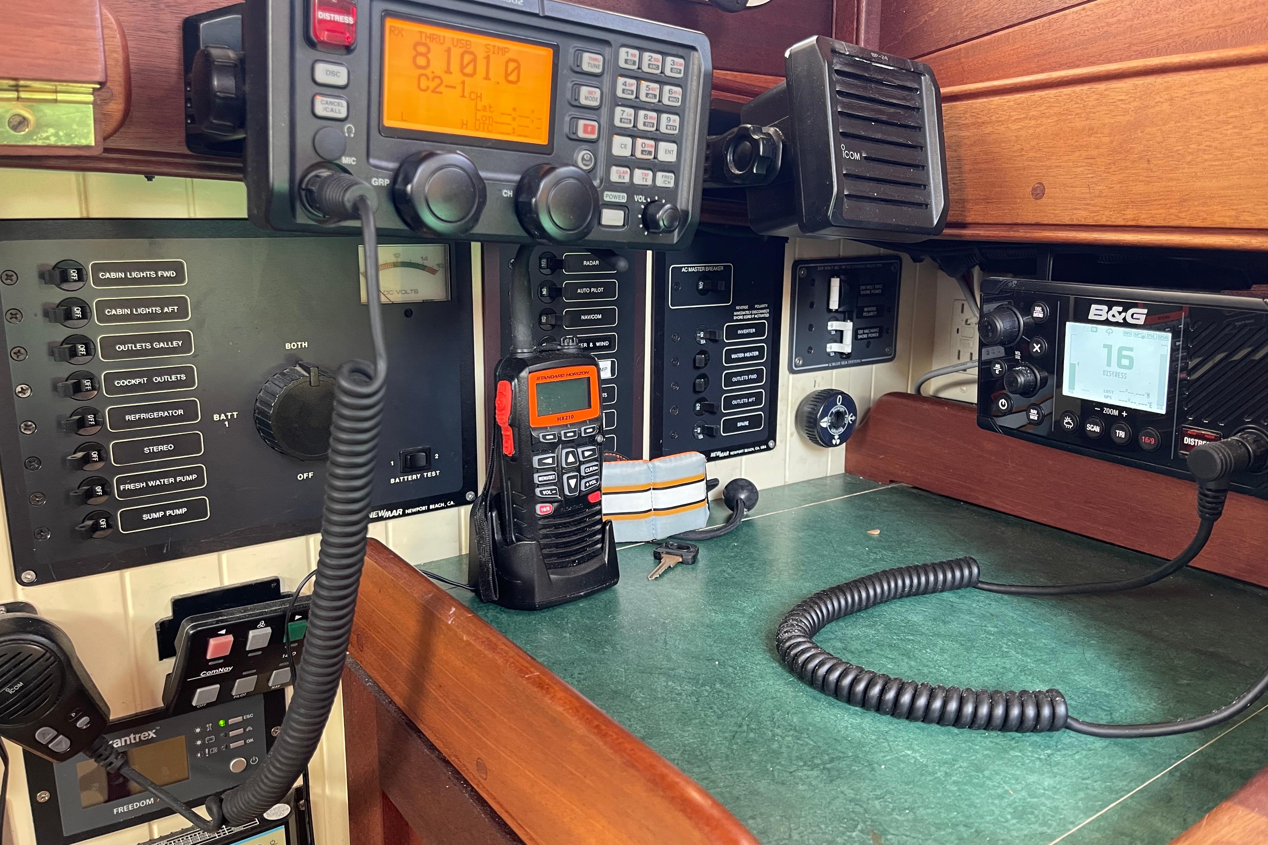 Control panel with communication devices and switches on a 2008 Pinky Custom boat.