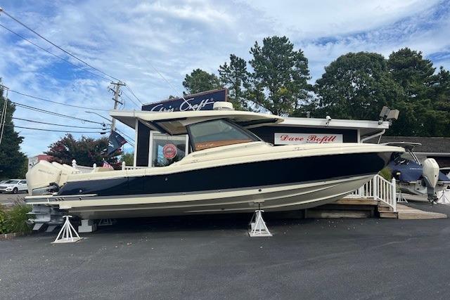 2024 Chris-Craft Calypso 35 boat displayed outdoors on stands.