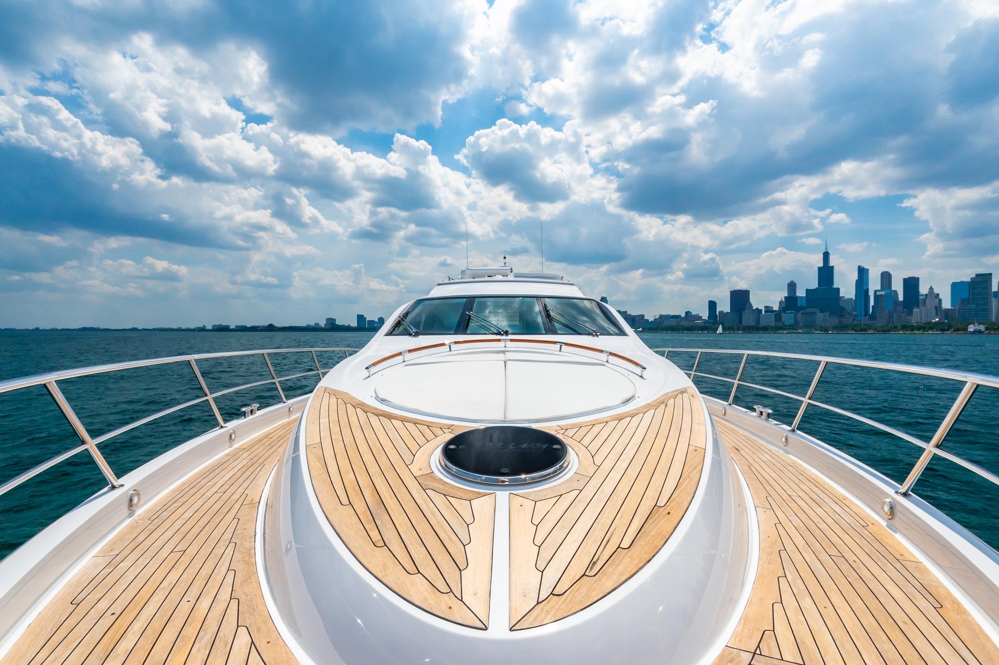 Lazzara-78 LSX TWIN ENGINES 2010-LATITUDE IL-US-Luxury Lazzara 78 LSX yacht cruising with city skyline and cloudy sky backdrop.-9307533 | Thumbnail