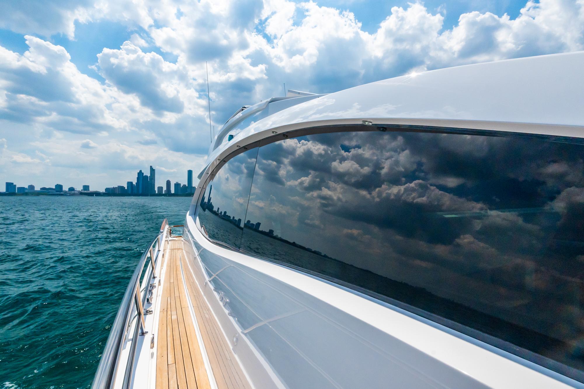 Lazzara-78 LSX TWIN ENGINES 2010-LATITUDE IL-US-Luxurious 2010 Lazzara 78 LSX yacht cruising near city skyline under cloudy sky.-9307533 | Thumbnail