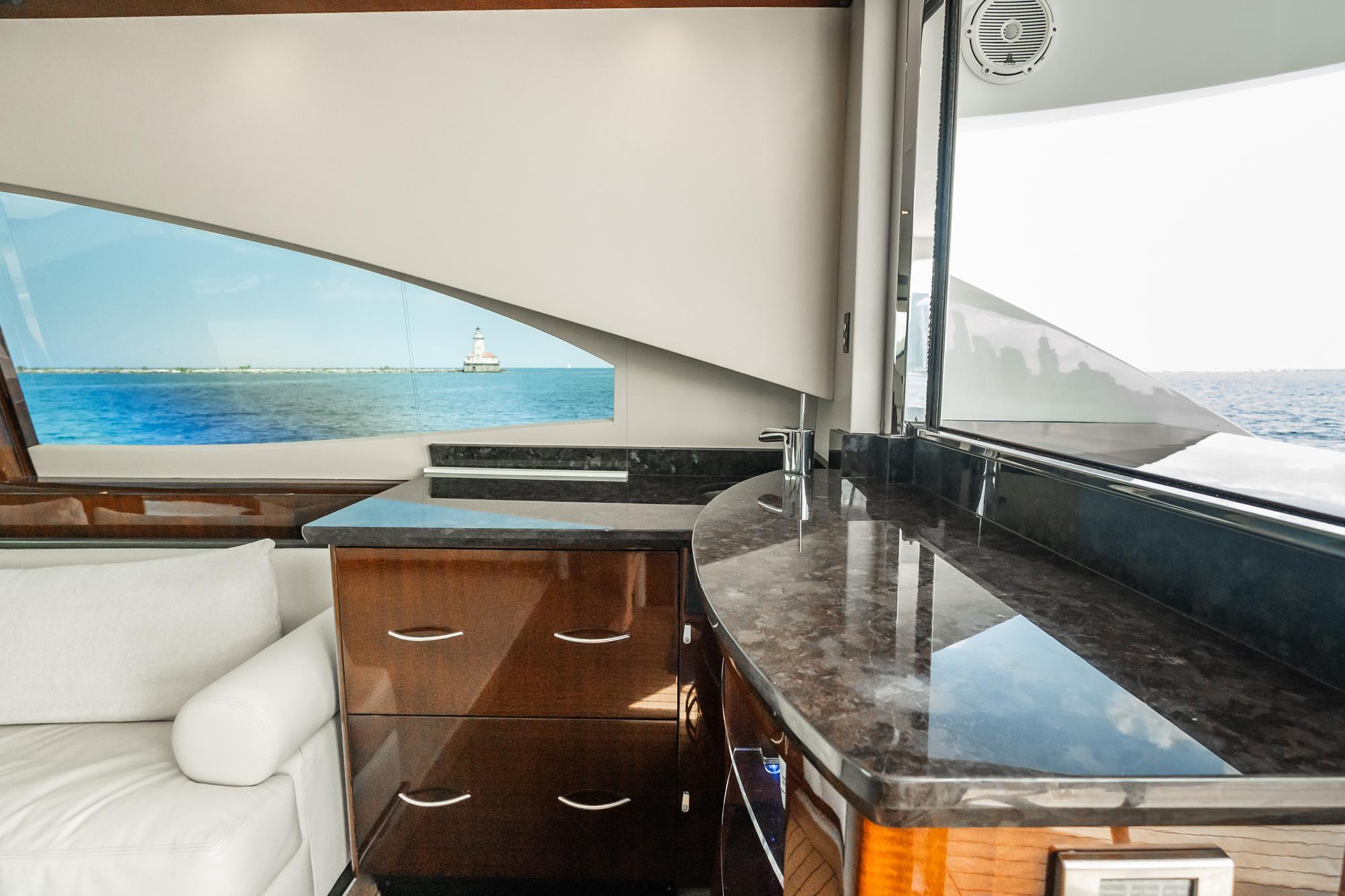 Lazzara-78 LSX TWIN ENGINES 2010-LATITUDE IL-US-Luxurious interior of 2010 Lazzara 78 LSX yacht with elegant wood cabinetry and ocean view.-9307533 | Thumbnail
