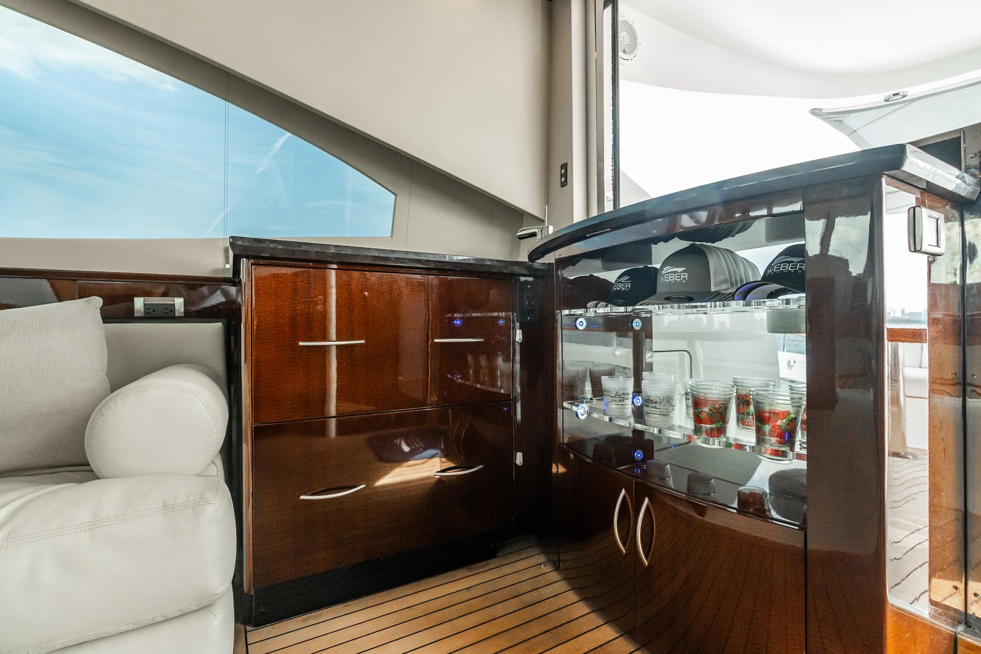 Lazzara-78 LSX TWIN ENGINES 2010-LATITUDE IL-US-Luxurious interior of 2010 Lazzara 78 LSX yacht with elegant cabinetry and glass display.-9307533 | Thumbnail