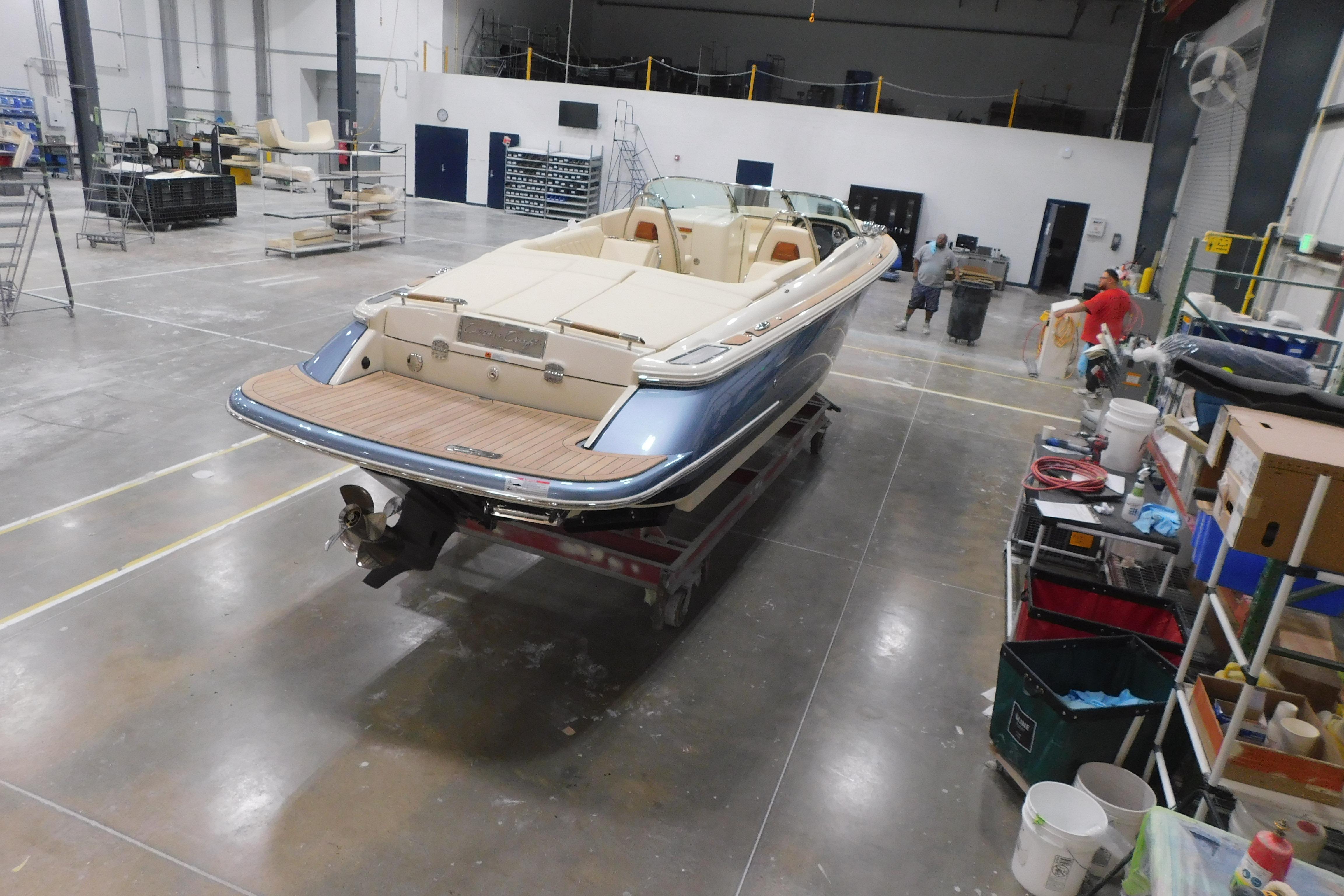 2026 Chris-Craft Launch 27 boat in a workshop, showcasing luxury design and craftsmanship.