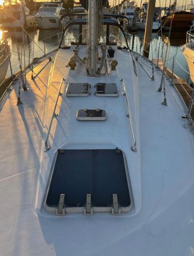 1985 Gib'Sea 126 sailboat deck at sunset in marina.