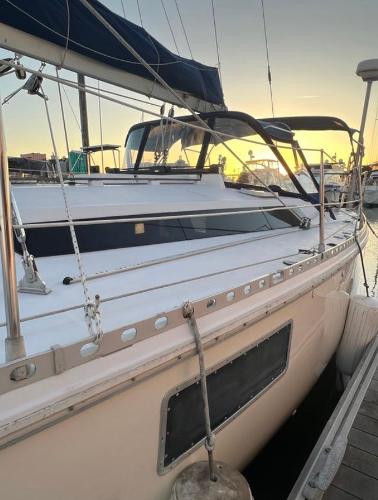 1985 Gib'Sea 126 sailboat docked at sunset, featuring sleek design and sturdy rigging.