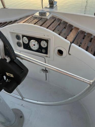 Cockpit of 1985 Gib'Sea 126 sailboat with steering wheel and instrument panel.