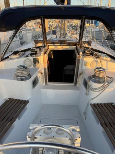 1985 Gib'Sea 126 sailboat cockpit with winches and seating, docked at marina.