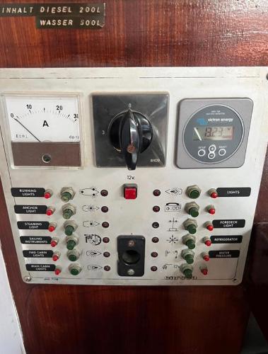 Control panel of a 1985 Gib'Sea 126 sailboat with various switches and gauges.