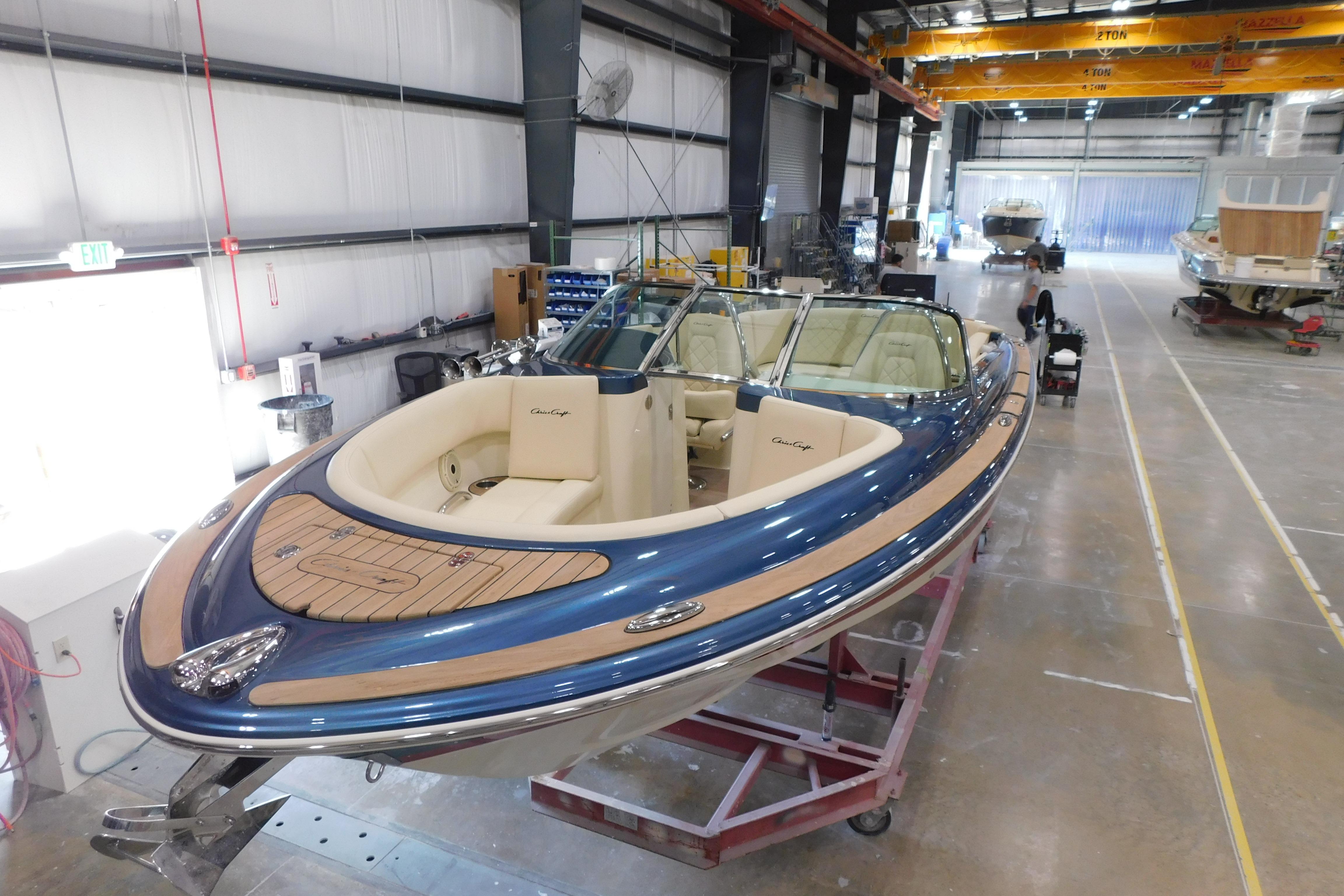 2025 Chris-Craft Launch 27 boat in a manufacturing facility, showcasing elegant design and craftsmanship.