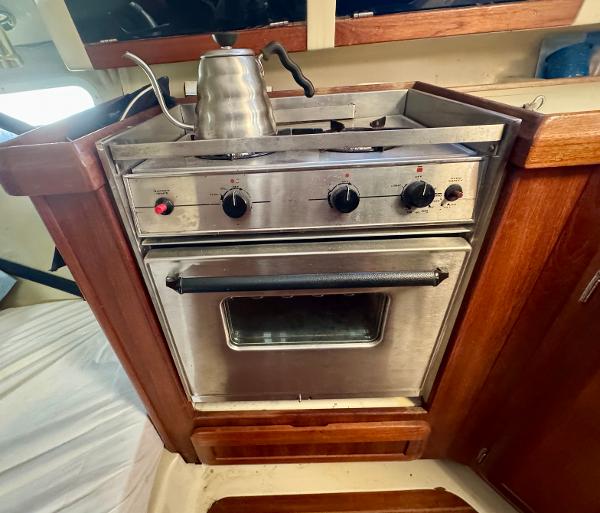 Stainless steel stove and oven in 1994 Hunter 29.5 sailboat galley.