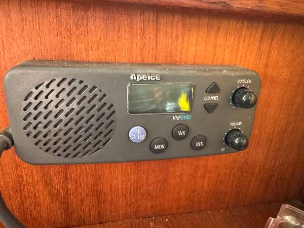 VHF radio on 1994 Hunter 29.5 sailboat, mounted on wooden panel.