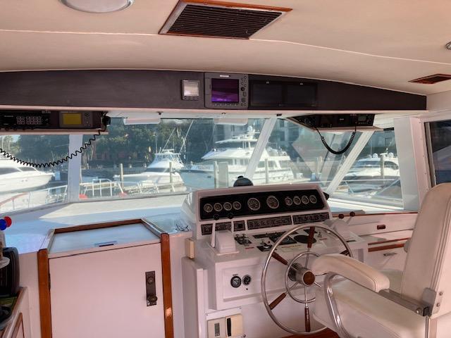 Bertram-58 Motor Yacht 1977-K Bear FL-US-Interior helm of 1977 Bertram 58 Motor Yacht with steering wheel and control panel.-9617651 | Thumbnail