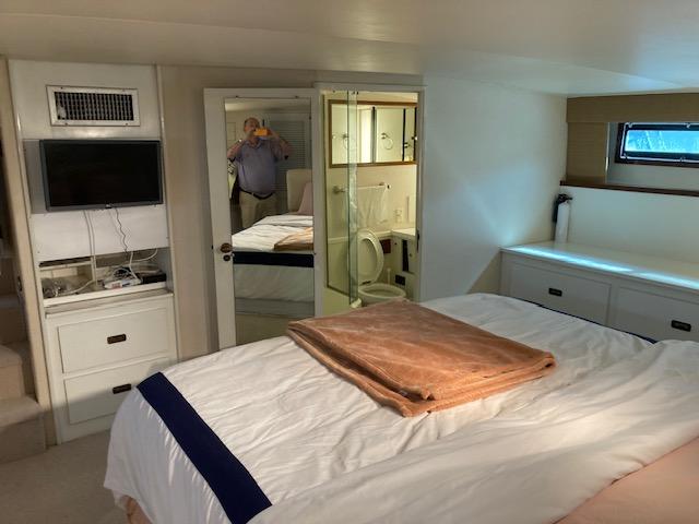 Bertram-58 Motor Yacht 1977-K Bear FL-US-1977 Bertram 58 Motor Yacht bedroom with TV, mirror, and ensuite bathroom.-9617651 | Thumbnail