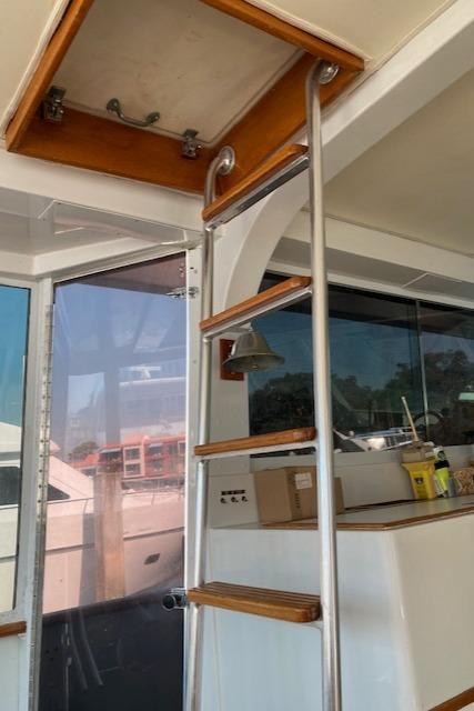 Bertram-58 Motor Yacht 1977-K Bear FL-US-Interior view of 1977 Bertram 58 Motor Yacht with ladder and hatch.-9617651 | Thumbnail