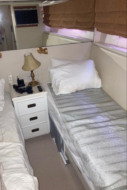 Bertram-58 Motor Yacht 1977-K Bear FL-US-Interior cabin of a 1977 Bertram 58 Motor Yacht with twin beds and a nightstand.-9617651 | Thumbnail