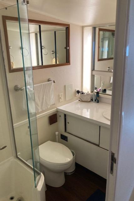 Bertram-58 Motor Yacht 1977-K Bear FL-US-1977 Bertram 58 Motor Yacht bathroom with modern fixtures and mirrored cabinets.-9617651 | Thumbnail